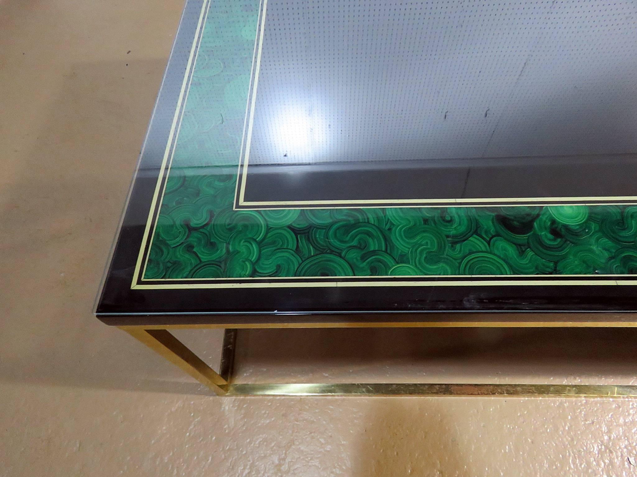 Maison Jansen paint decorated coffee table with a brass base.