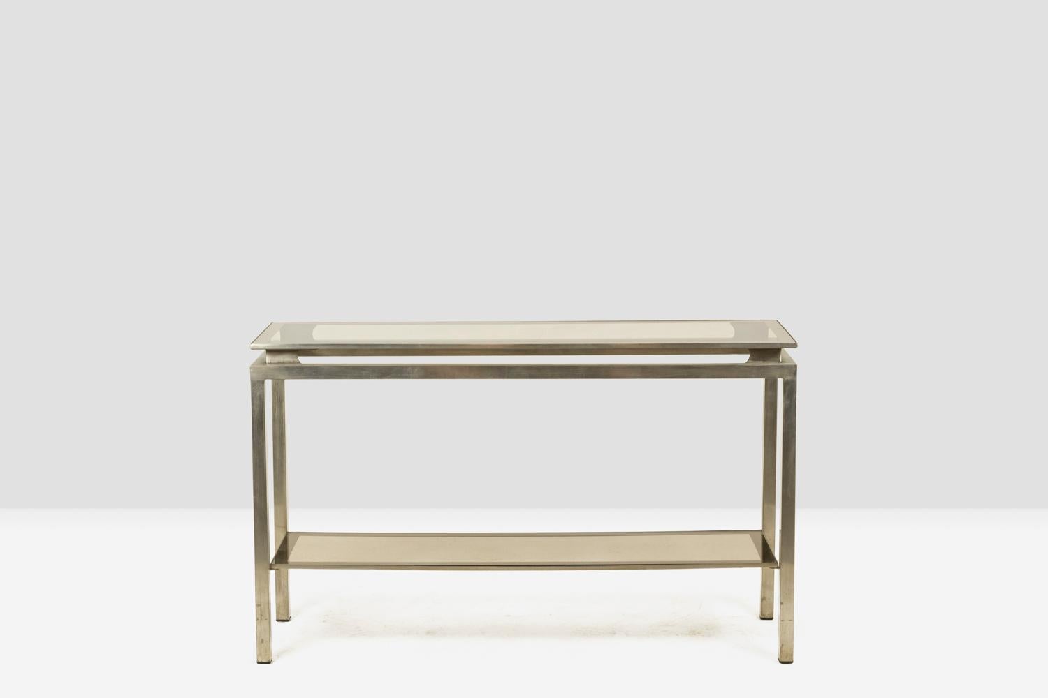 Maison Jansen, by.

Console in brushed metal with two smoked glass shelves, rectangular in shape.

French work realized in the 1970s.