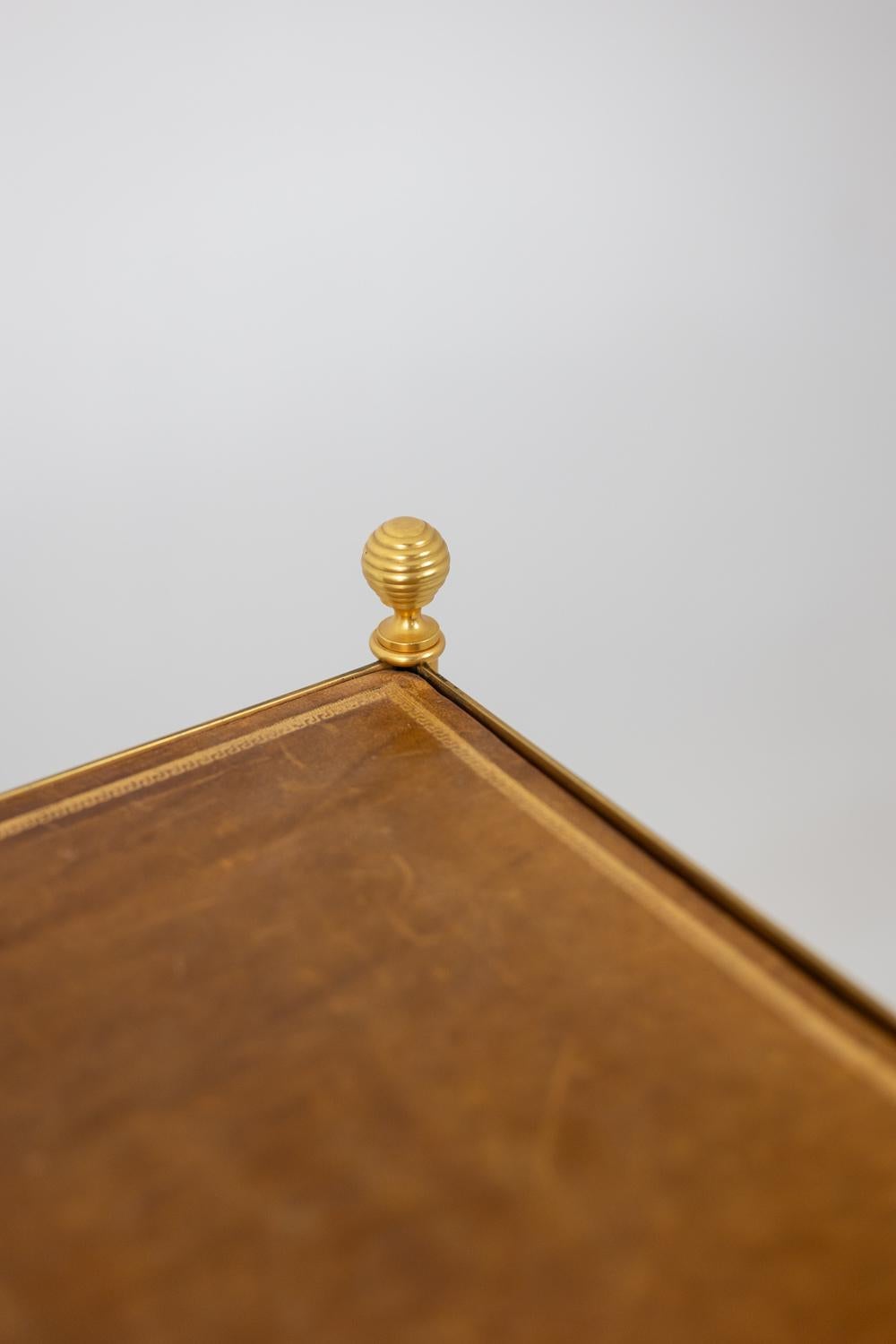 20th Century Maison Jansen. Console in gilded brass and tan leather. 1970s. For Sale