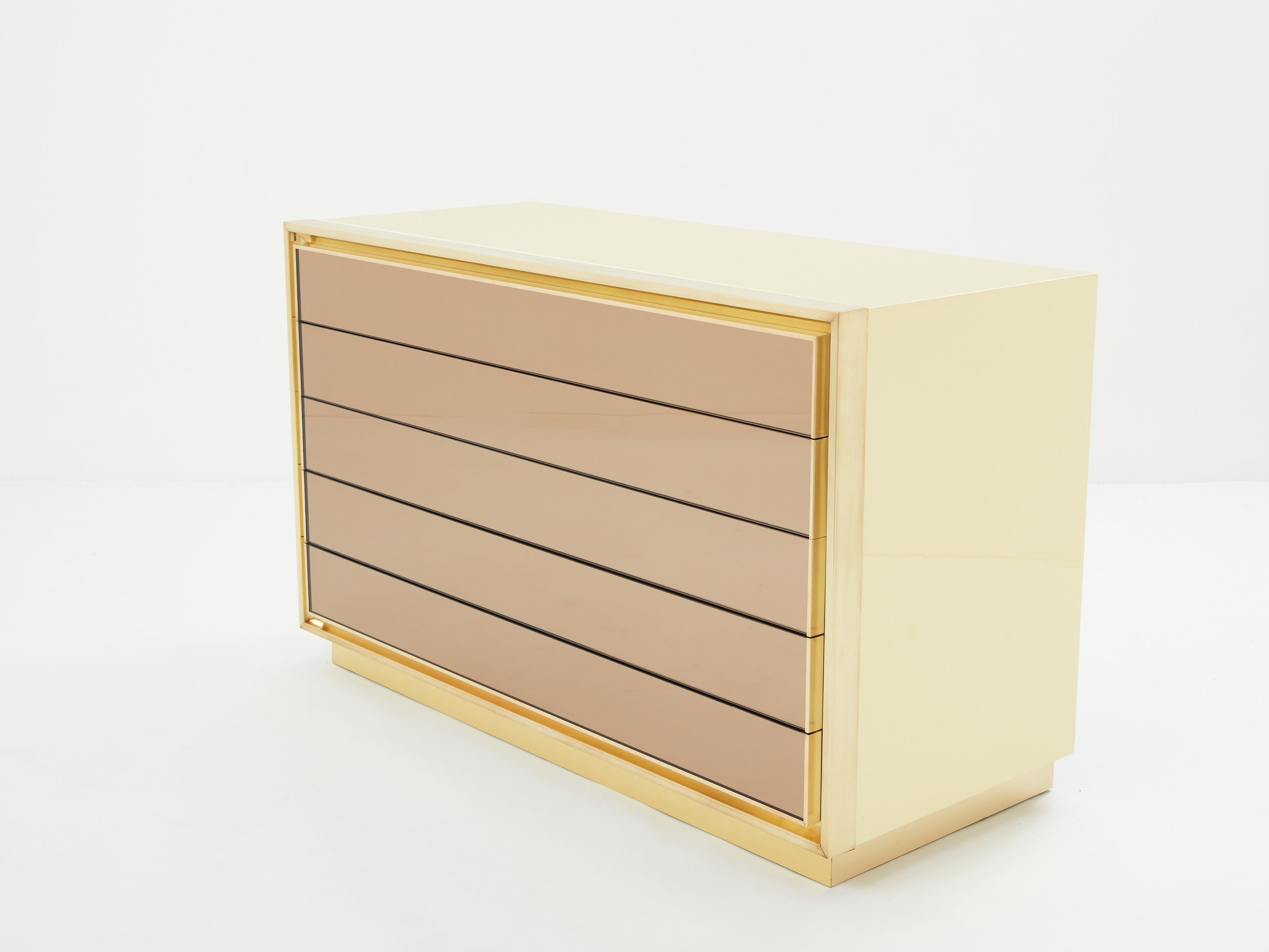 This rare Maison Jasen five drawers, cream lacquered chest of drawers would be stunning in any bedroom or living room. Made to order by Maison Jansen in France in the late 1970s, the soft cream lacquer paired with brushed brass frames all around the