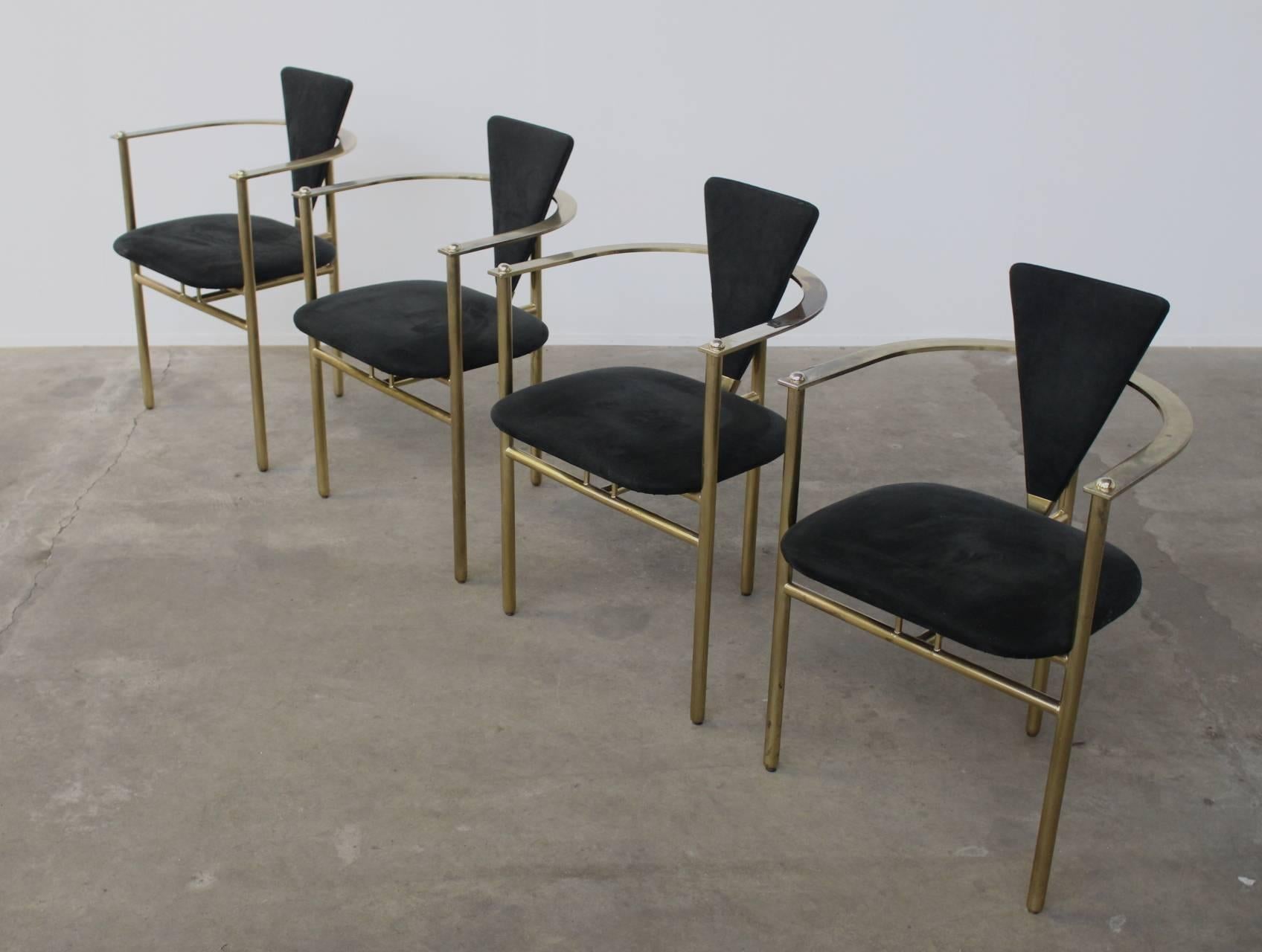 Beautifully designed 3-leg brass dining chairs with a perfect condition black velvet upholstery. Absolutely wonderful eye catchers in your dining room.