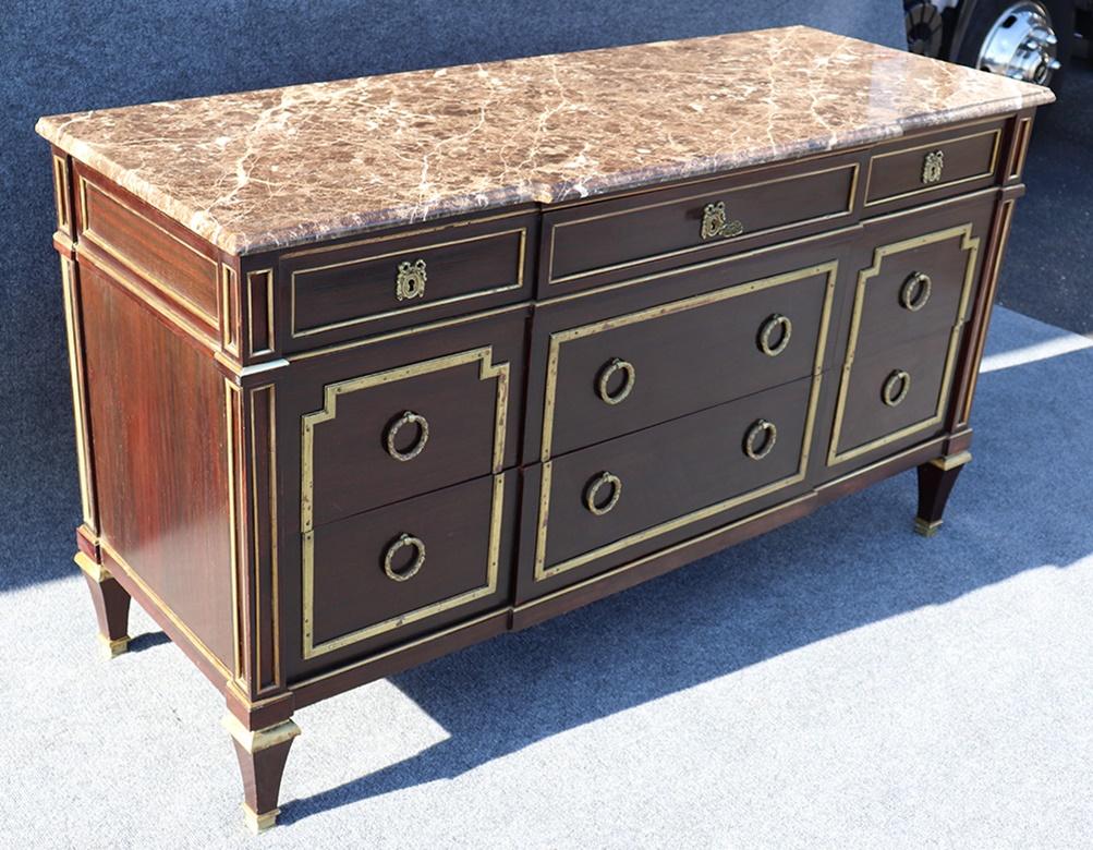 This is a grand scale commode. Maison Jansen Directoire style mahogany 9-drawer, bronze mounted, marble-top commode.
