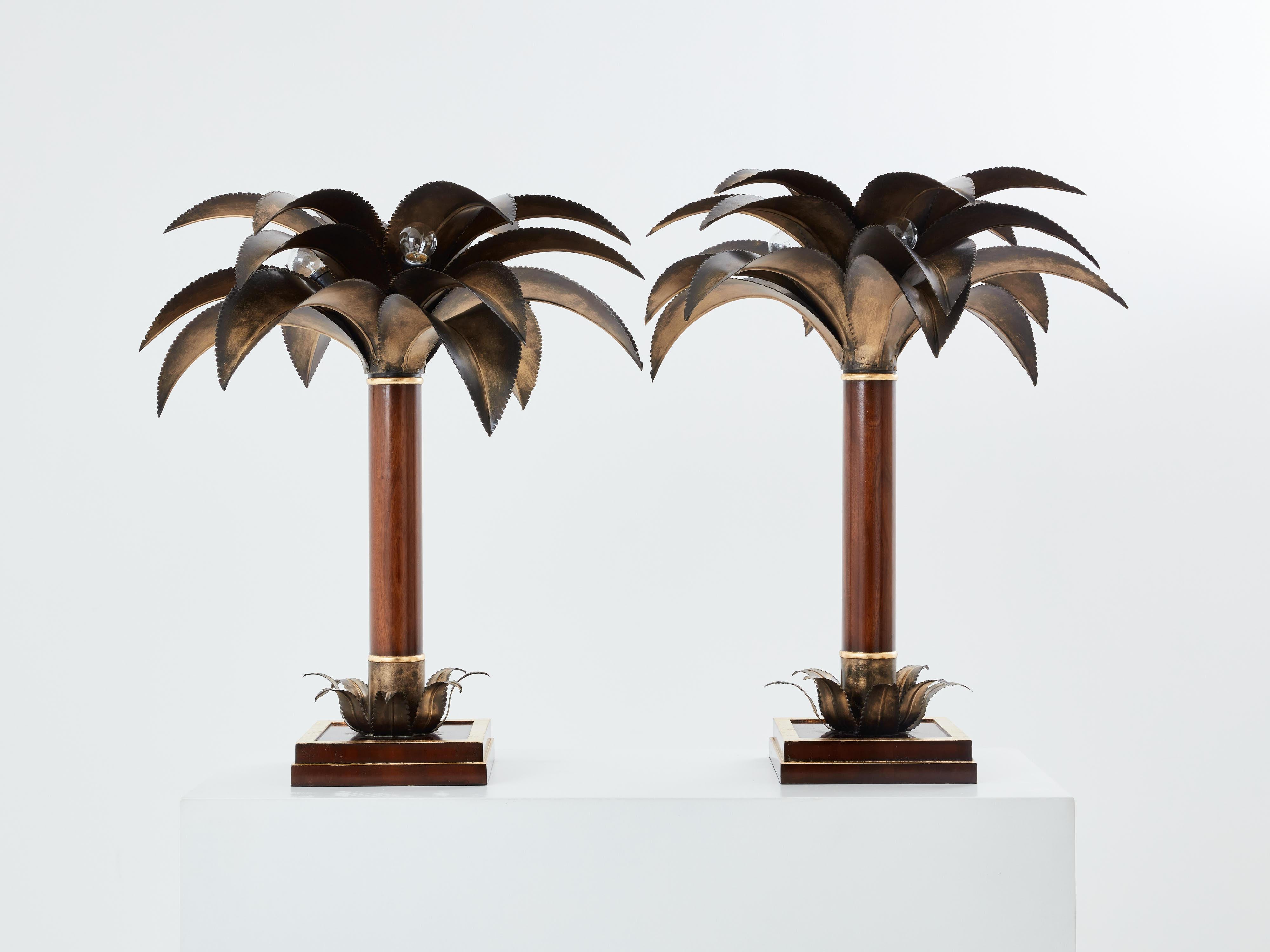 This beautiful pair of palm tree table lamps is a rare find, an early 1960s version of one of the most iconic pieces by Maison Jansen. The base and trunk are made of French mahogany wood, with gold leaf gilt accents. But what makes these Jansen palm