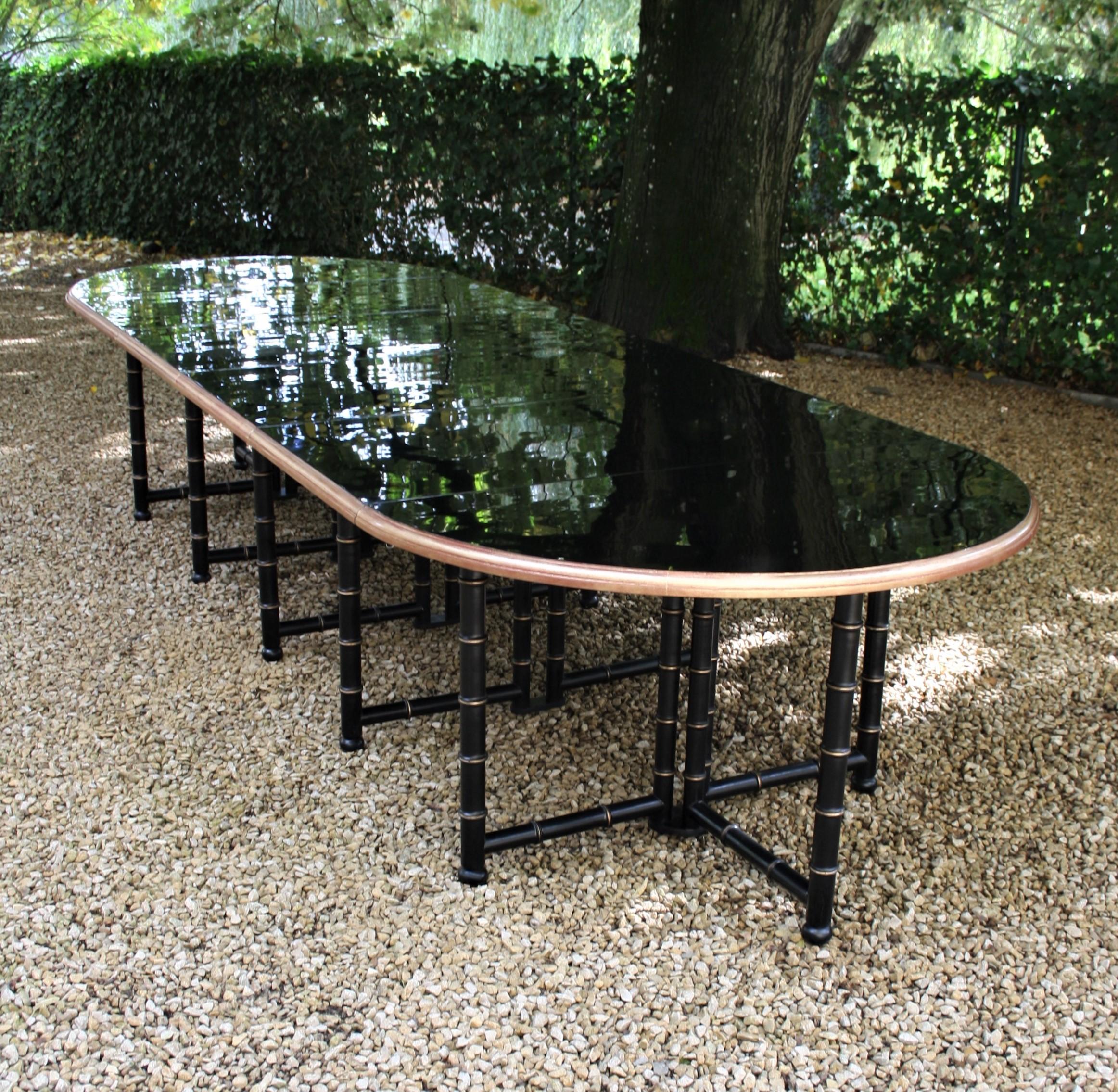 This extremely large table was commissioned for a country retreat in Normandy.
This table can be used as a dining table or as a conference table.
Made of lacquered and gilded beechwood and the tabletop are lacquered in high gloss black.
The table