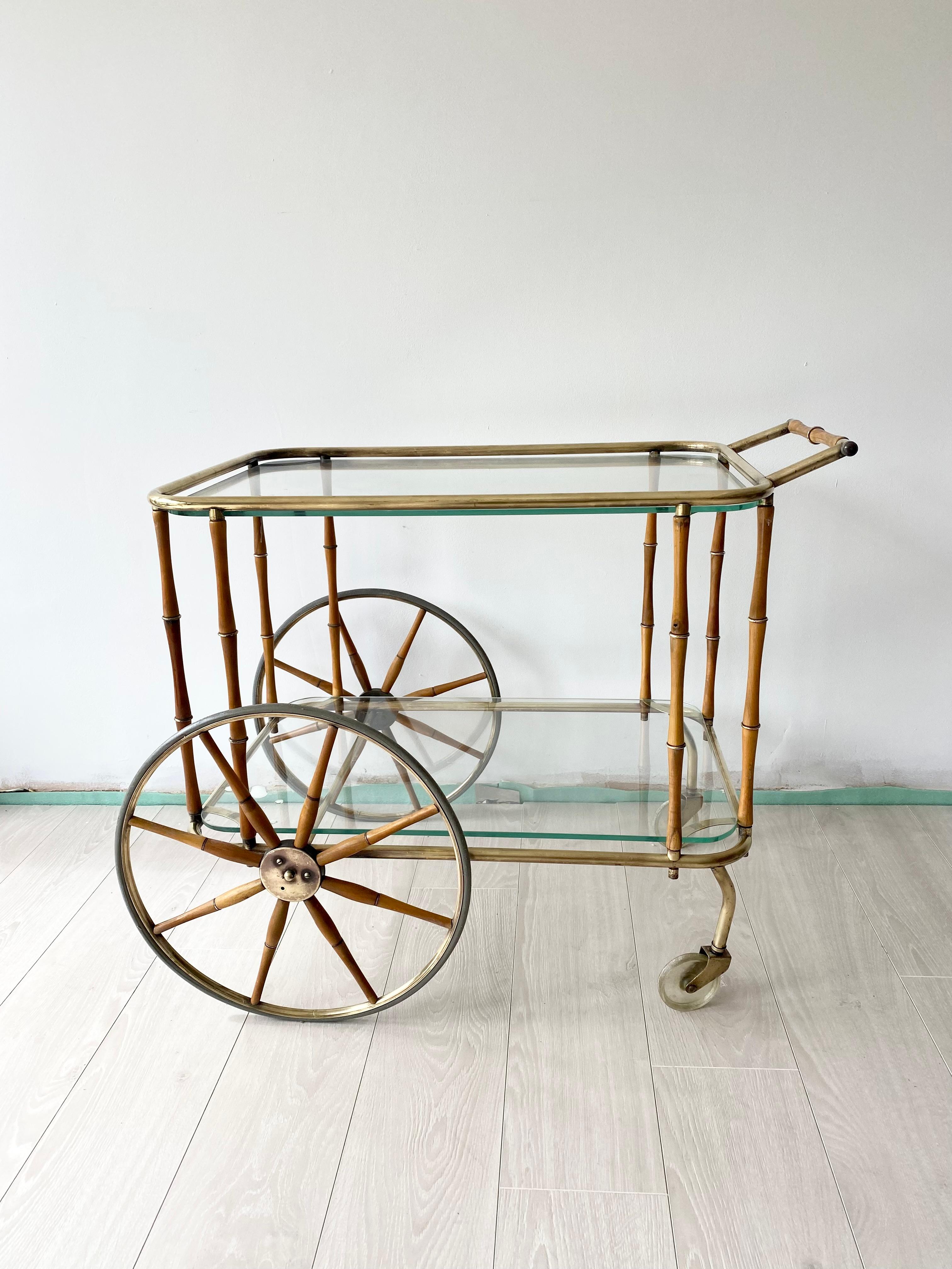 A rare 20th century bar cart attributed to Maison Jansen, faux bamboo and brass frame - polished back to enhance the overall appearance

Wear consistent with age and use

Measures 80cm wide, 54cm deep and stands 61cm to glass (66cm to