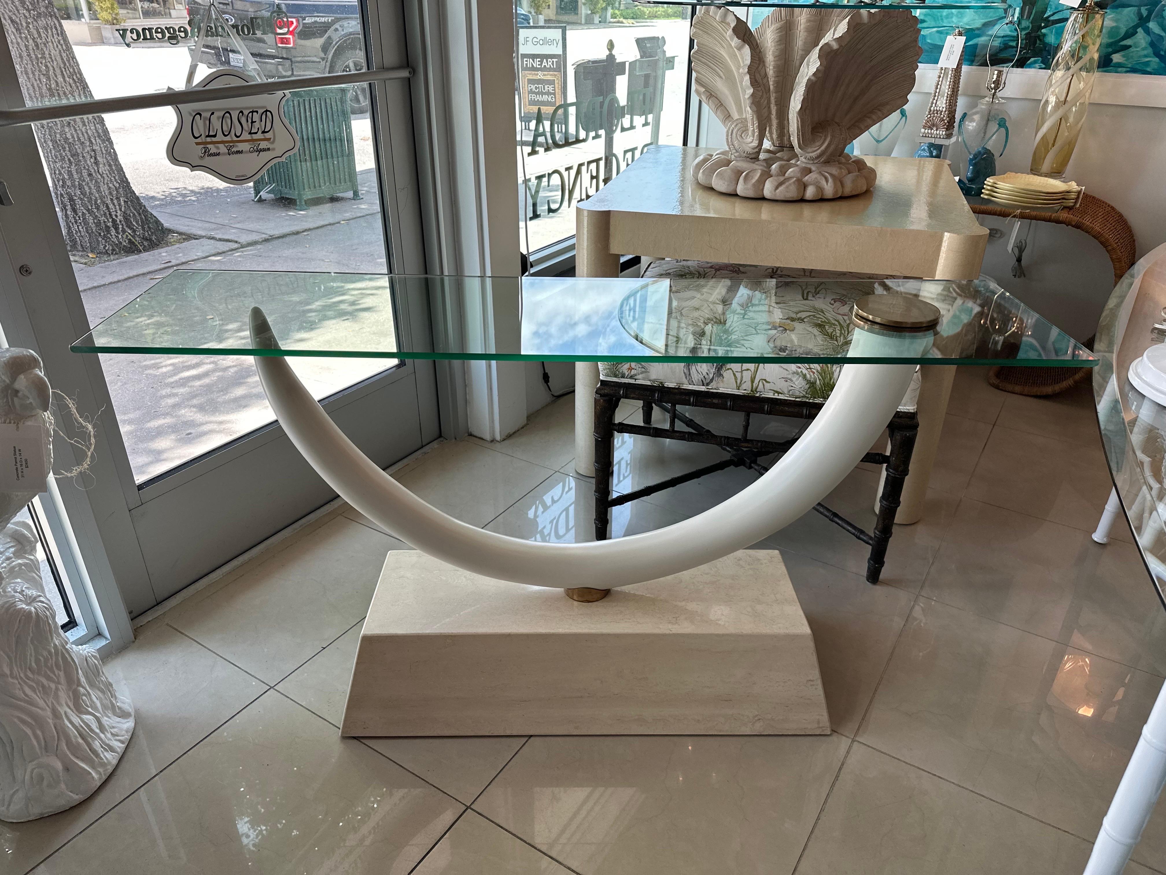 Beautiful vintage Maison Jansen faux elephant console table with marble base. Brass screw on glass top. No damage but the glass is original vintage and may have minor scratches, no chips or breaks. Horn can rotate to either side. Dimensions: 57 W x