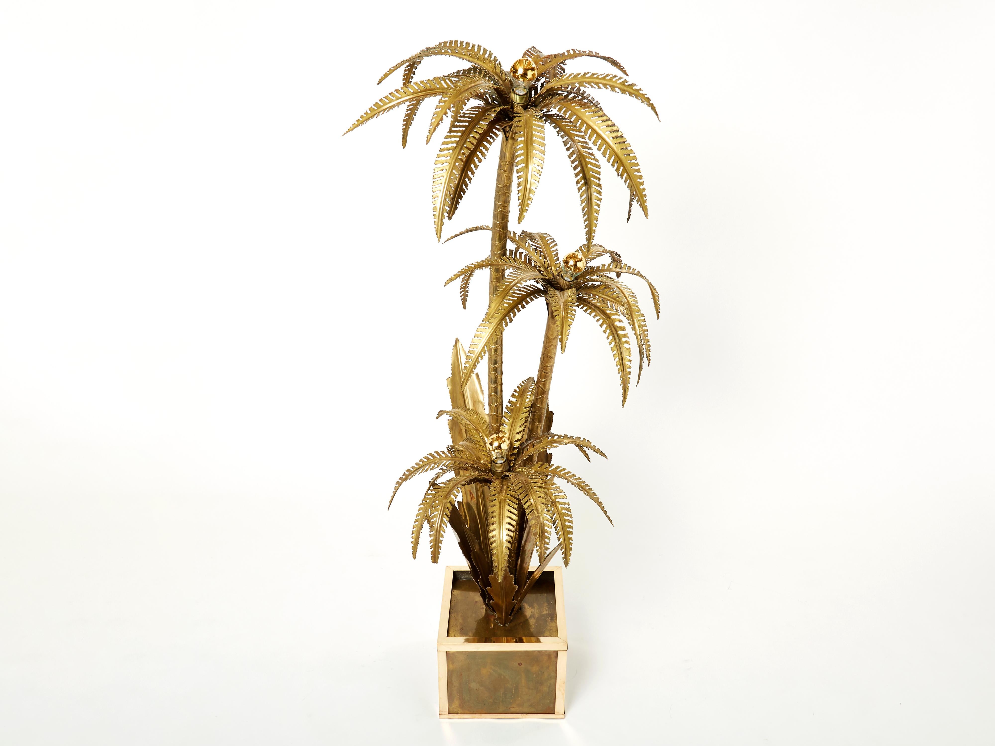 These palm tree floor lamps are one of the most iconic pieces by French design firm Maison Jansen. This rare example is made largely from bright brass, which gives it an air of high-end glamour. But what makes the Jansen palm tree pieces most