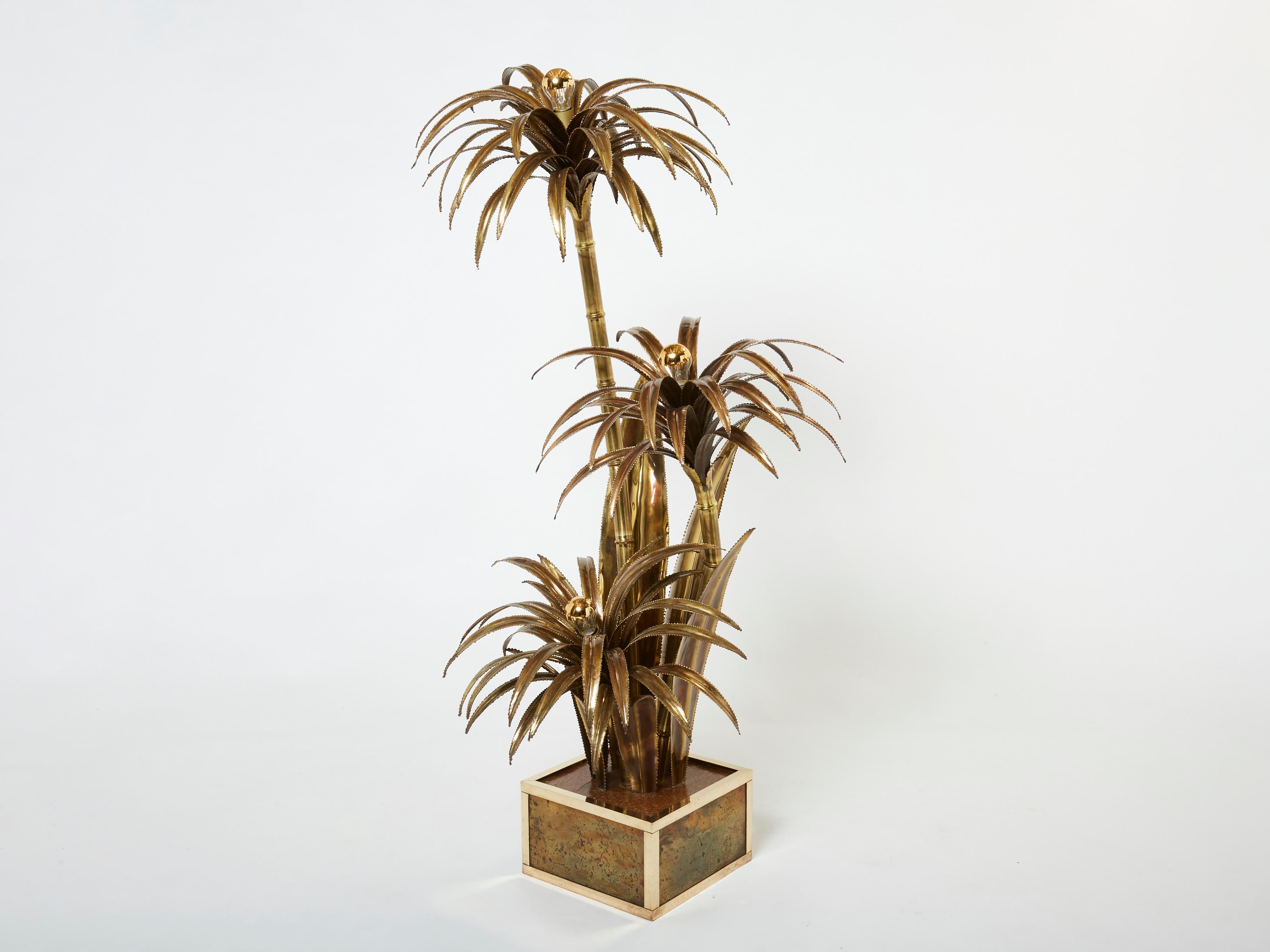 These palm tree floor lamps are one of the most iconic pieces by French design firm Maison Jansen. This rare example is made largely from bright brass, which gives it an air of high-end glamour. But what makes the Jansen palm tree pieces most