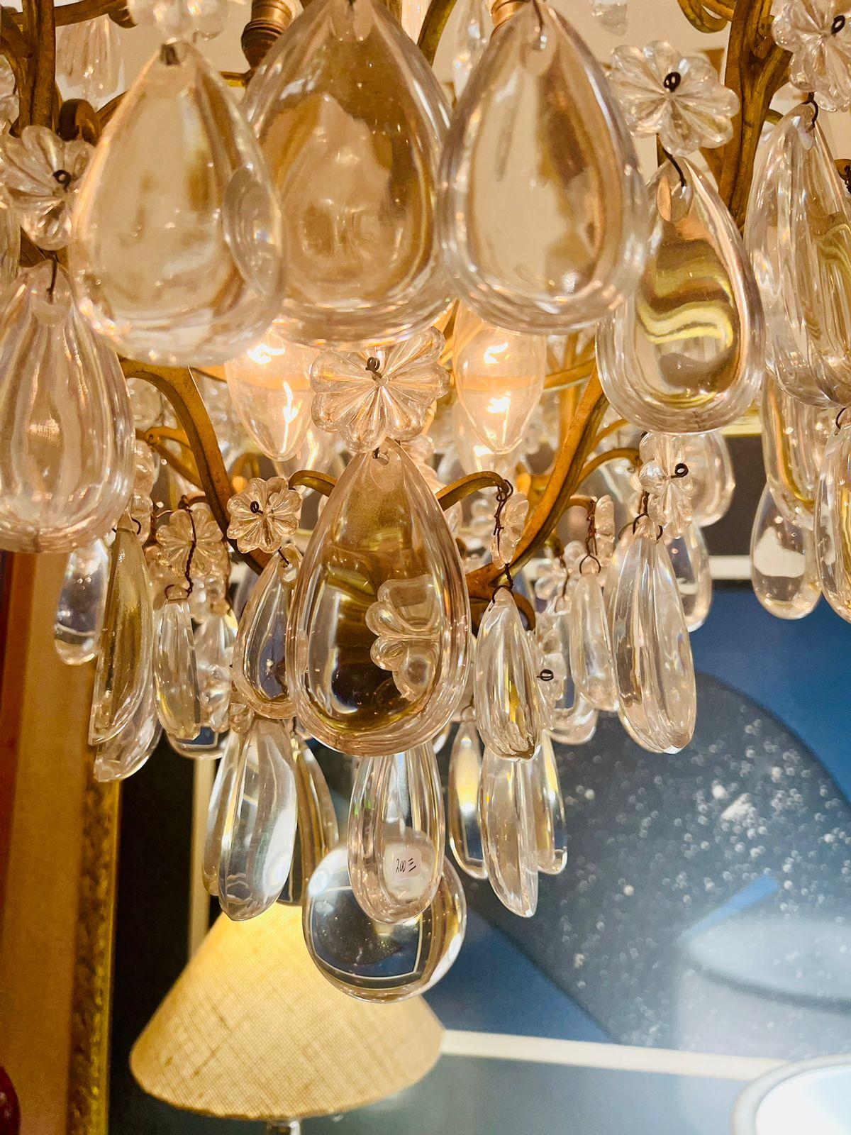 Incredible Maison Jansen chandelier in rock cristal, glass and metal circa 1930 with drops and flowers.