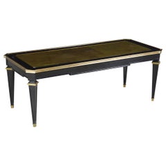 Table basse française du milieu du siècle dernier, de la Maison Jansen, en verre doré et ébénisé