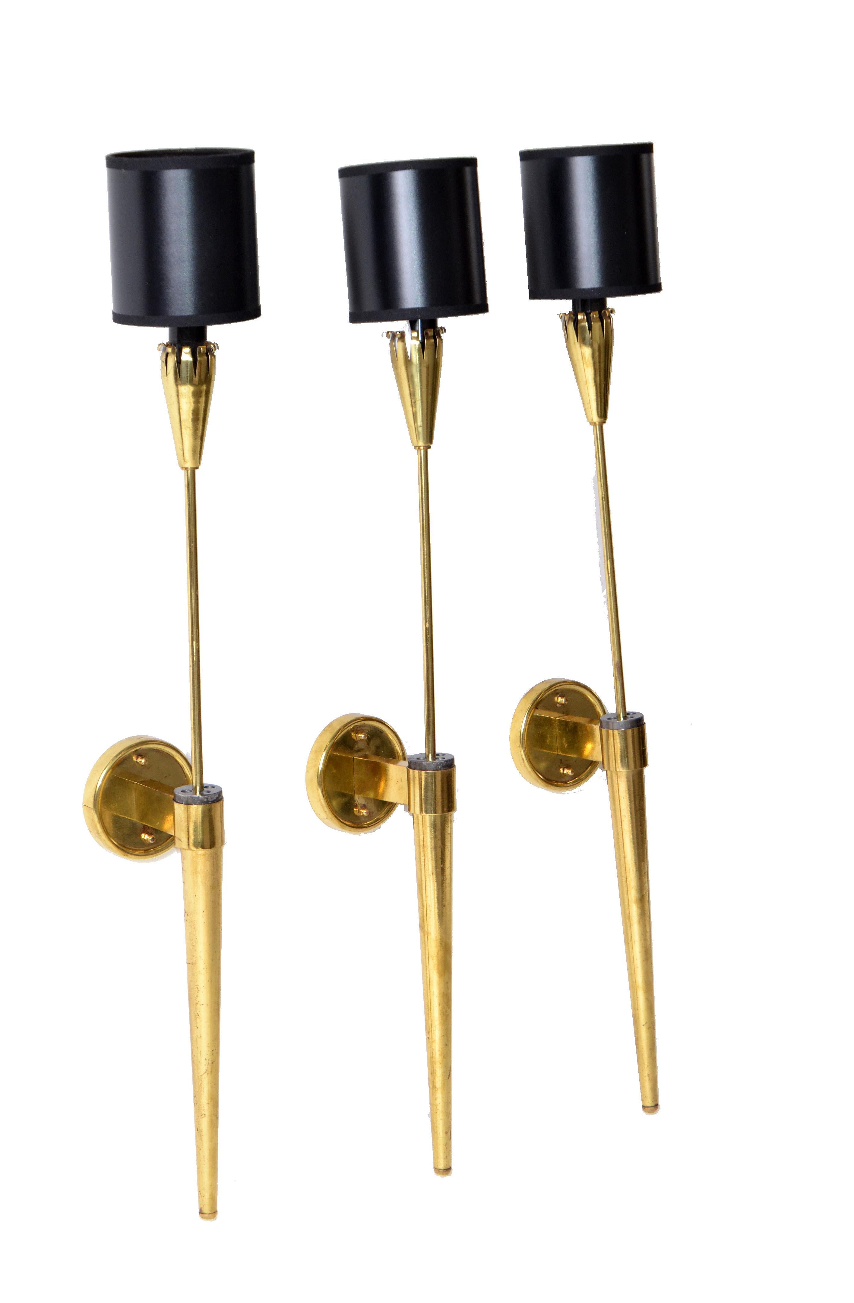 Mid-Century Modern set of 3 Maison Jansen style brass torch wall sconces with black and gold drum paper shades.
US re-wired and each one takes a max 40 watts candelabra light bulb.
Back plate measures 3.5 inches diameter.