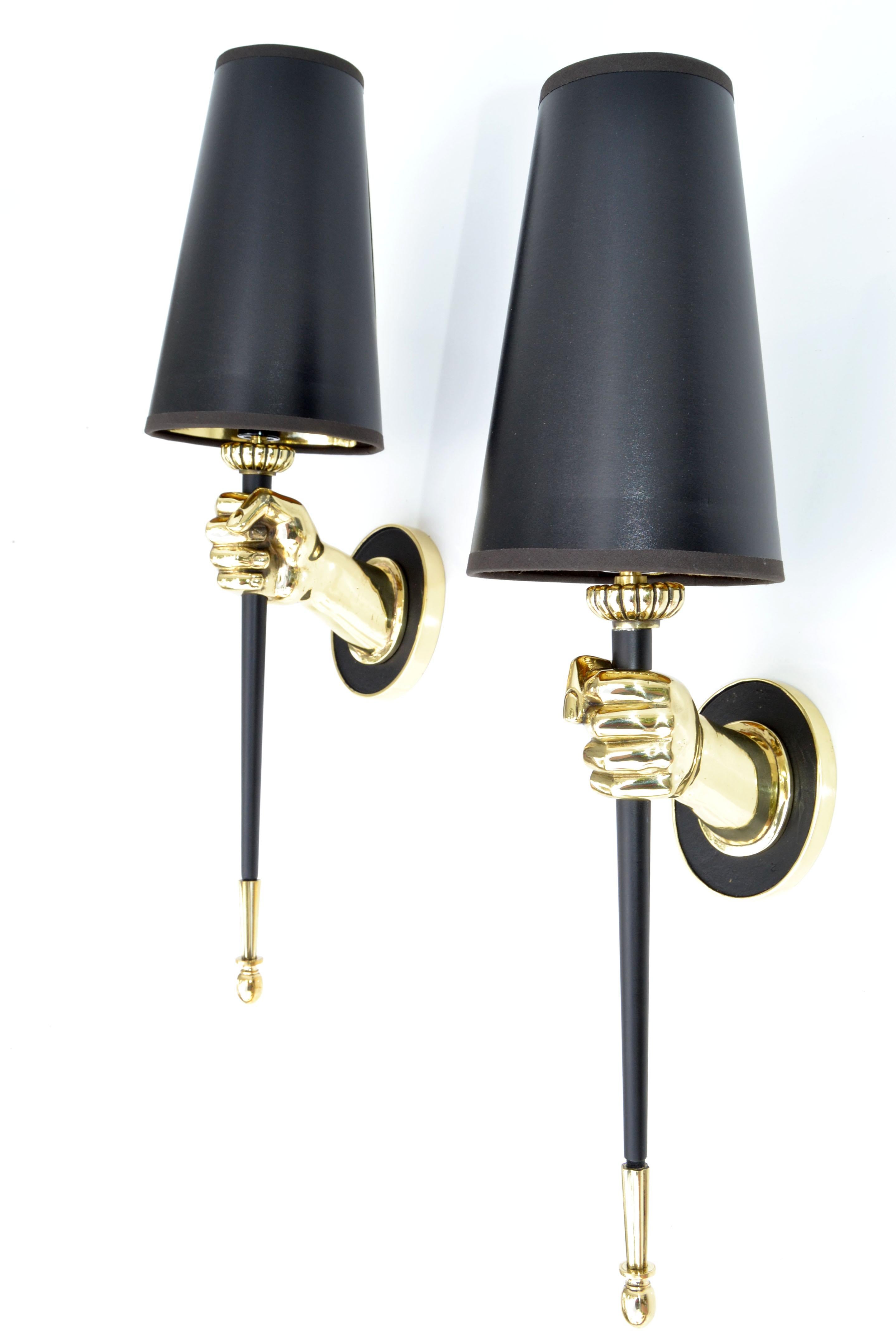 Impressive pair of sconces by Maison Jansen figuring a bronze hand holding a black lacquered torch.
One light, 60 watts max. US rewired.
Dimension without shade: 14 inches height, 3 1/4 inches width, 6 inches depth.
Projection back plate 4.5 H, 3