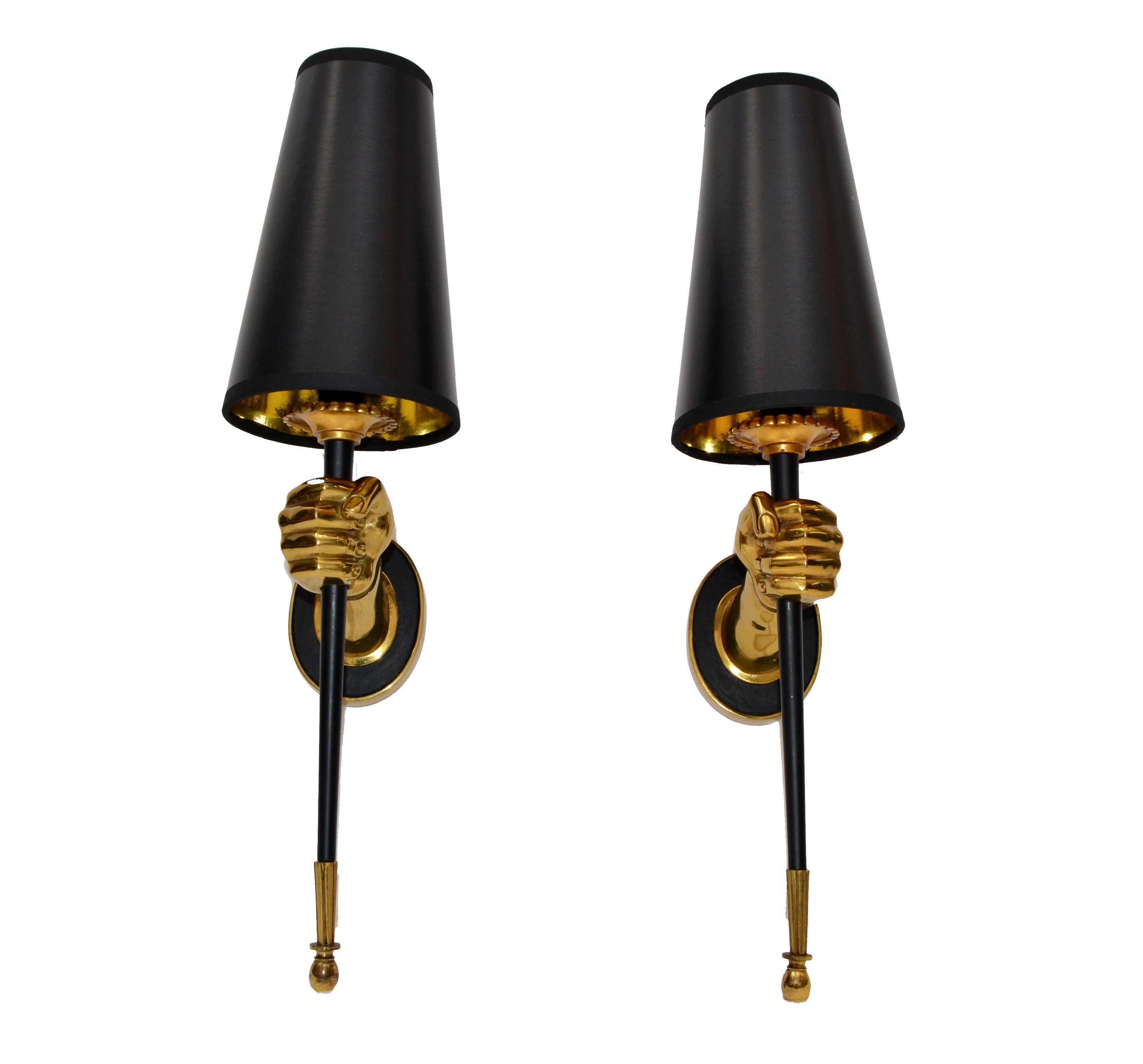 Impressive pair of sconces by Maison Jansen figuring a bronze hand holding a black lacquered torch.
One light, 60 watts max. US rewired.
Dimension without shade: 13 inches height, 3 1/4 inches width, 6 inches depth.
Projection backplate 4.5 H, 3