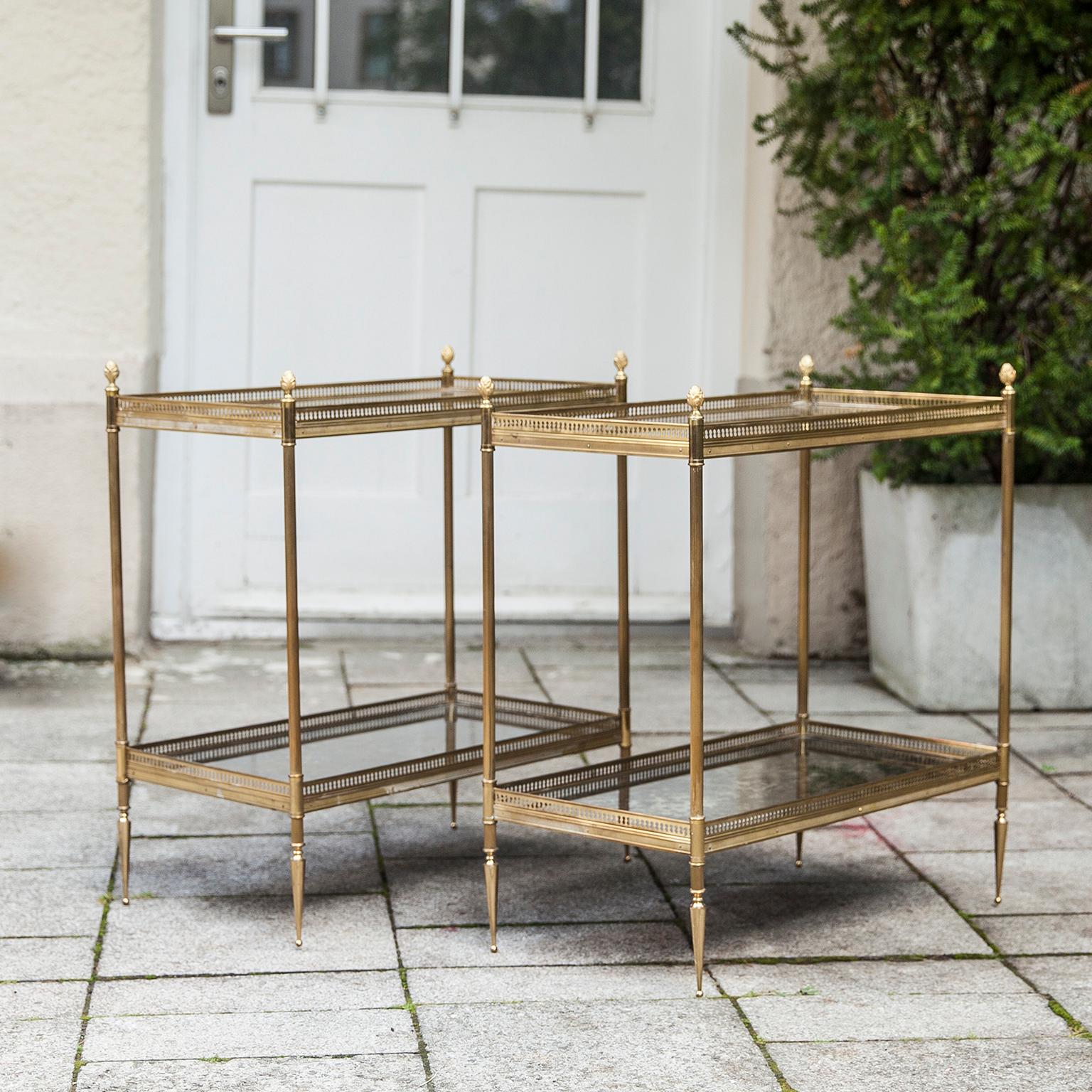 Elegant and high quality side tables in brass and gilt glass inlays from the interior of the Hotel Bar from the famous Munich Grand Hotel “Königshof”, they were made by Maison Jansen in 1968.
  