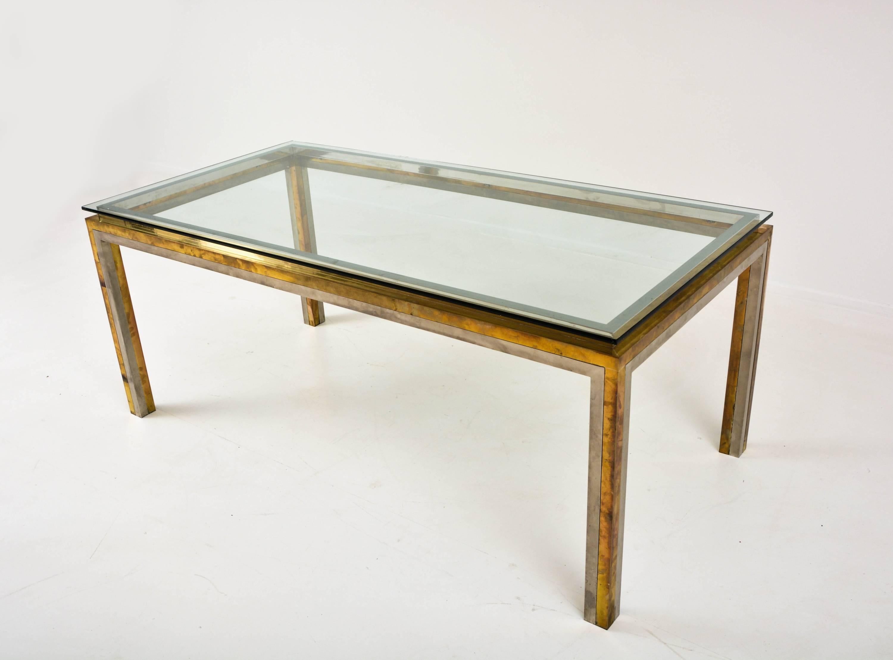 Maison Jansen glass brass and chrome dining table, France, 1970s.

Beautiful dining table by Maison Jansen, France, 1970s with excellent patina.
Simply a wonderful dining room piece.
 