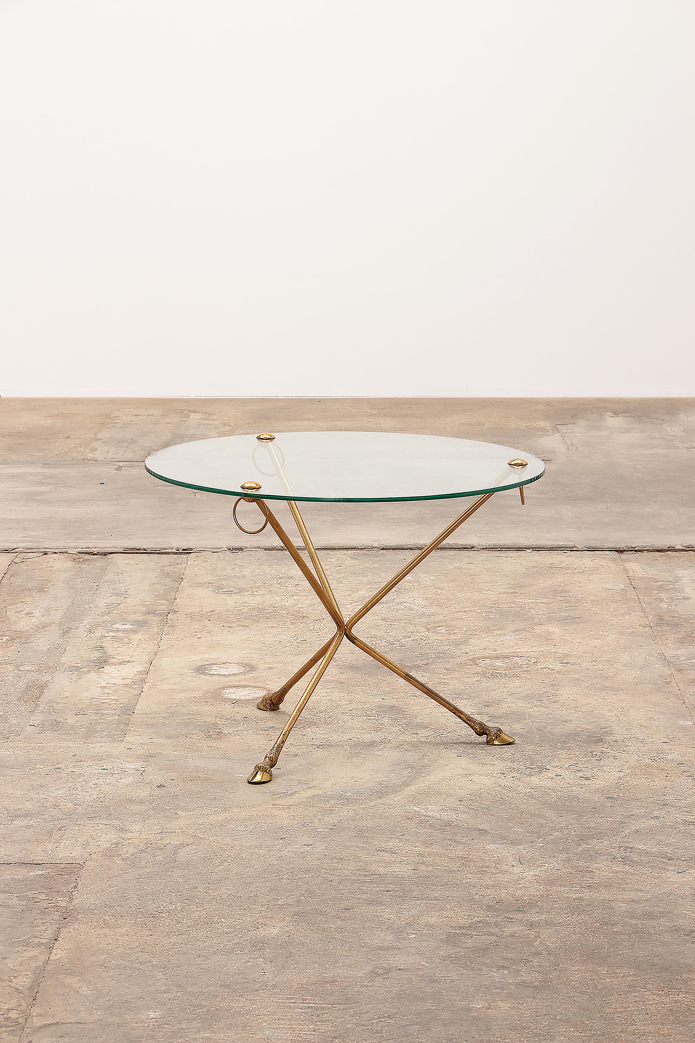 Beautiful brass coffee table from Maison Jansen France.

Made in the 1960s, the legs are beautifully finished with goat legs, at the top the well-known rings with a cool round glass plate.

Sustainable: environmentally conscious By supplementing