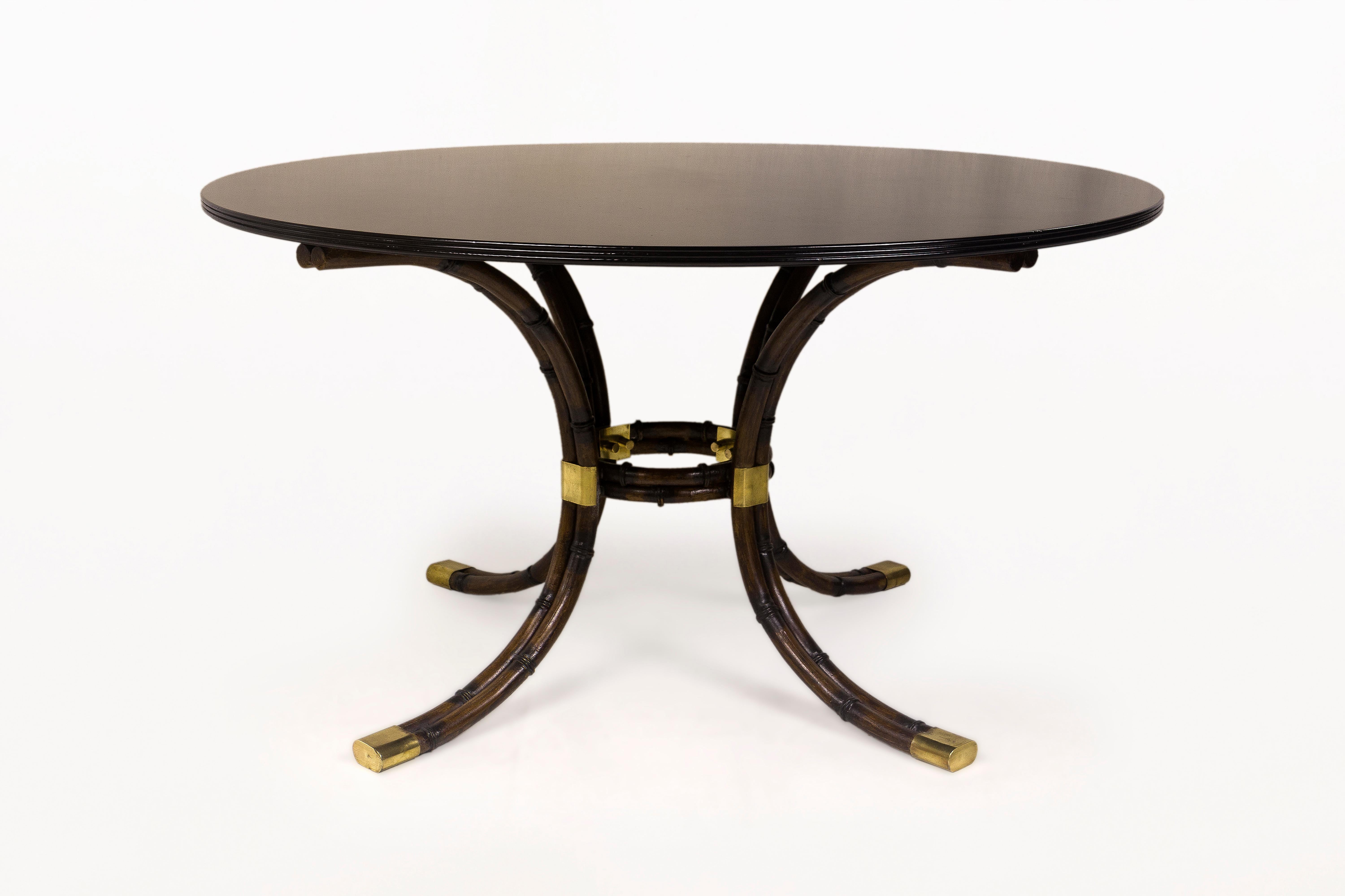 Maison Jansen guéridon.
Faux bamboo legs and black lacquered top,
circa 1970, France.
Good vintage condition.
Maison Jansen was a Paris-based interior decoration office founded in 1880 by Dutch-born Jean-Henri Jansen. Jansen is considered the