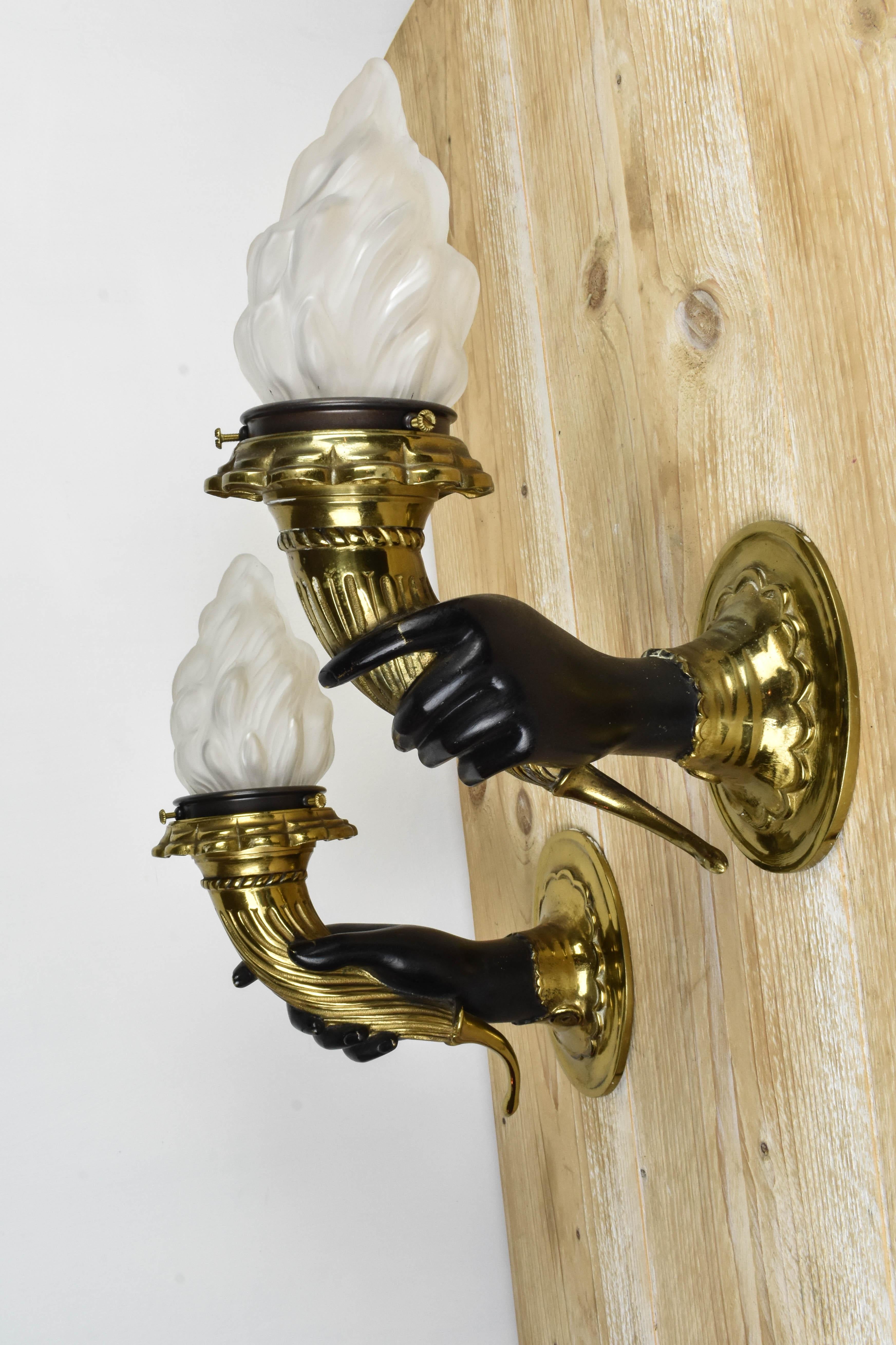 Beautiful right and left hand torch sconces from circa 1950.