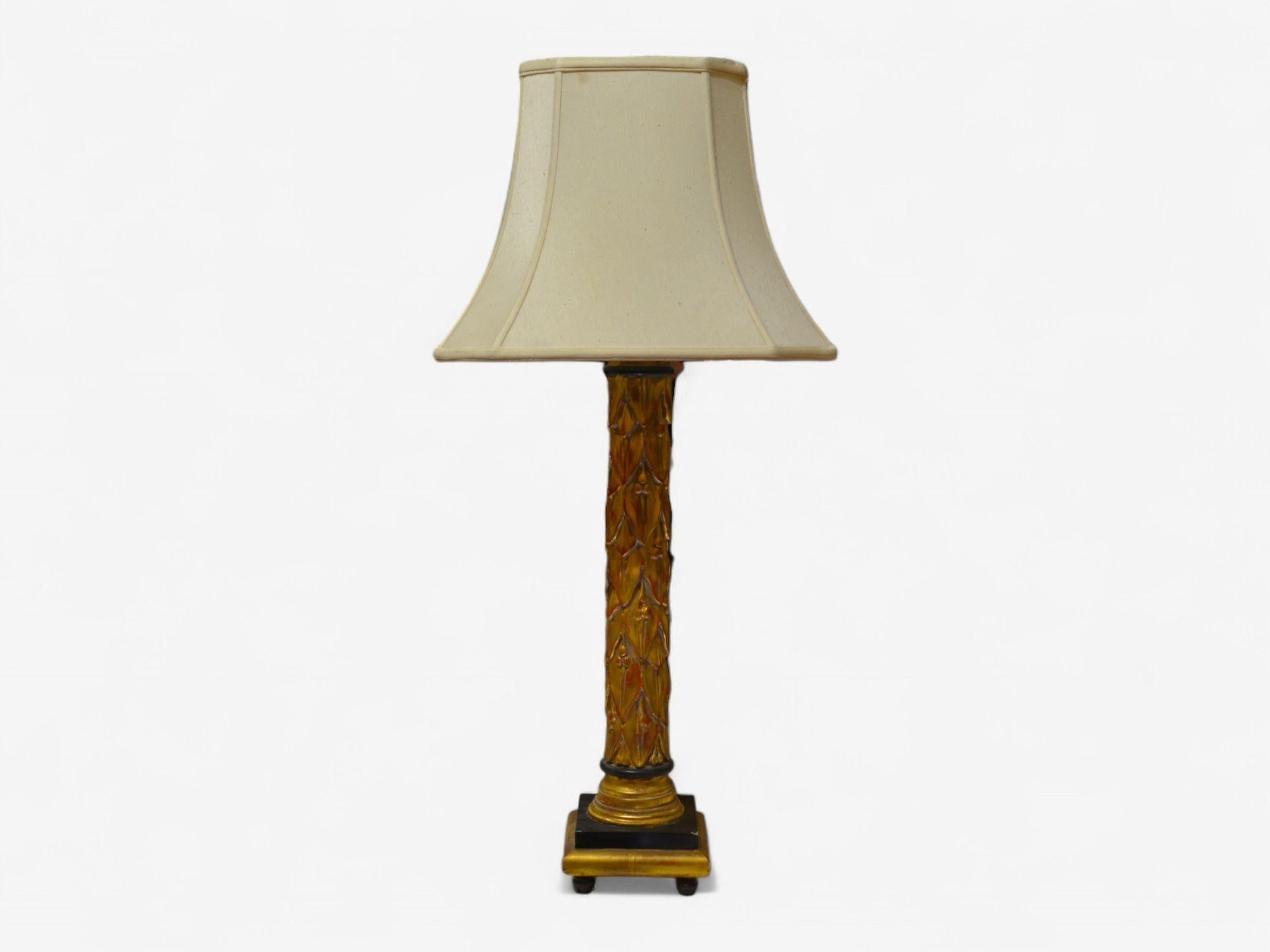 Maison Jansen, Hollywood Regency, Giltwood, Table Lamps, France, 1950s

Pair of Maison Jansen table lamps featuring gilt gold Fleur-de-Lis and ebony accents designed and produced in 20th century France. Includes finely carved grape details within