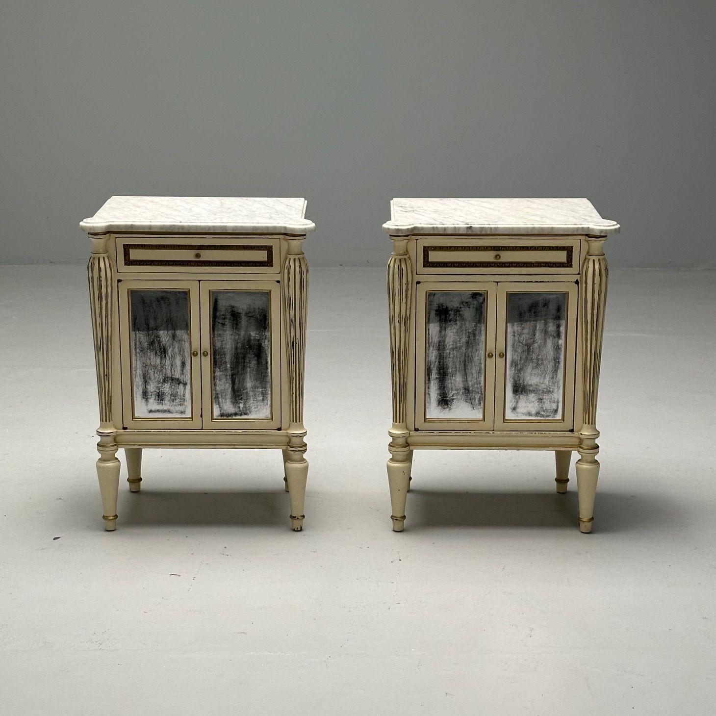 Pair of Painted Marble Top End Tables Distressed Mirrored Cabinets Stamped Jansen

Pair of French white distress-painted cabinets, circa 1950s, the white marble over a conforming case fitted with a single drawer with bronze banding, over a mylar