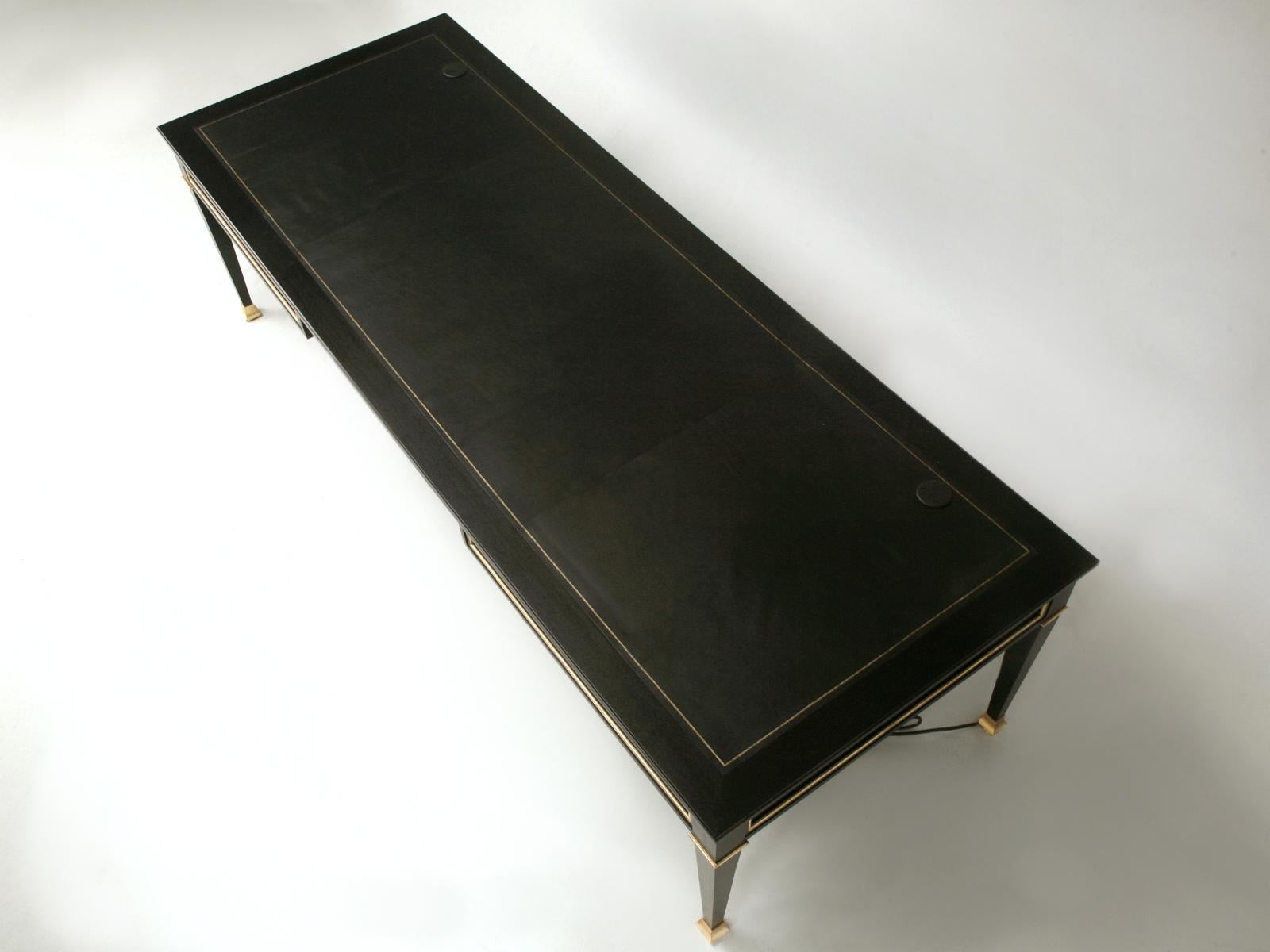 Maison Jansen inspired French Louis XVI style ebonized mahogany desk, with gold or brass accents, made here at Old Plank in our very own workshop. This impressive Maison Jansen Louis XVI inspired desk has an embossed and gilded leather top with 2