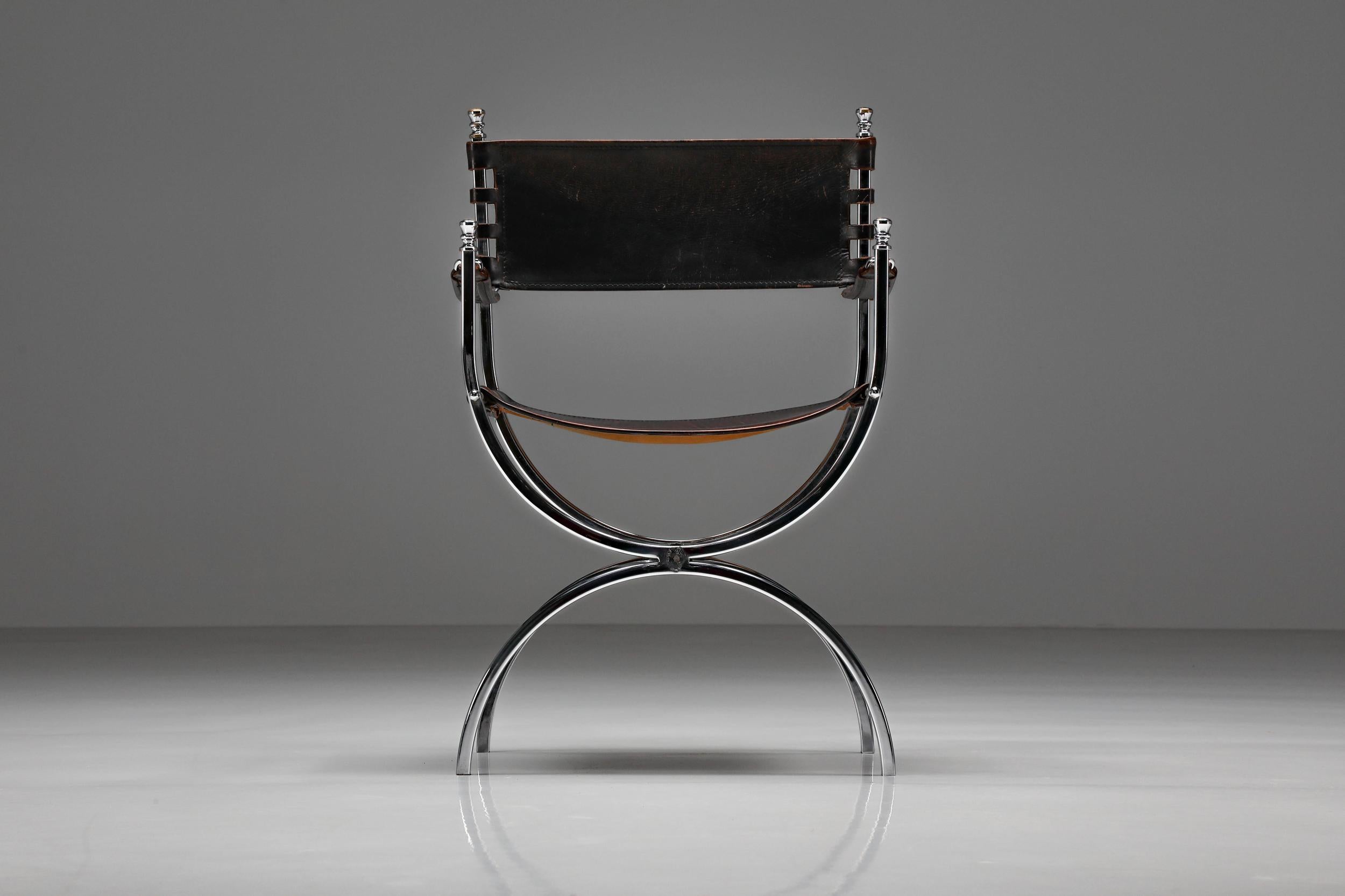 Maison Jansen; Hollywood Regency; neoclassical; Emperor chair; Chrome; Leathers; Eclectic interior; 

“Savonarola” Emperor chair by Maison Jansen was made in the 1970s. Luxury Maison Jansen armchairs with elegant chrome frames and beautifully