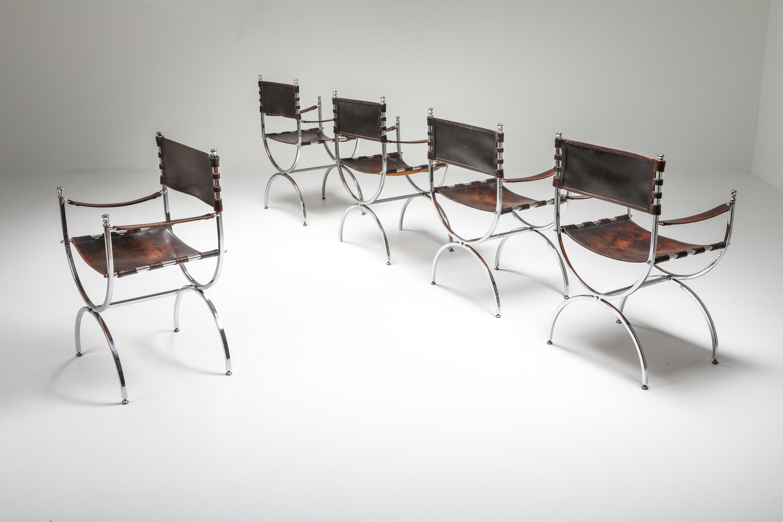 “Savonarola” Emperor chairs by Maison Jansen, 1970s.

Stunning set of five luxury Maison Jansen armchairs with elegant chrome frames
and beautifully patinated thick brown leather, seats, back and armrests.
Produced in France during the