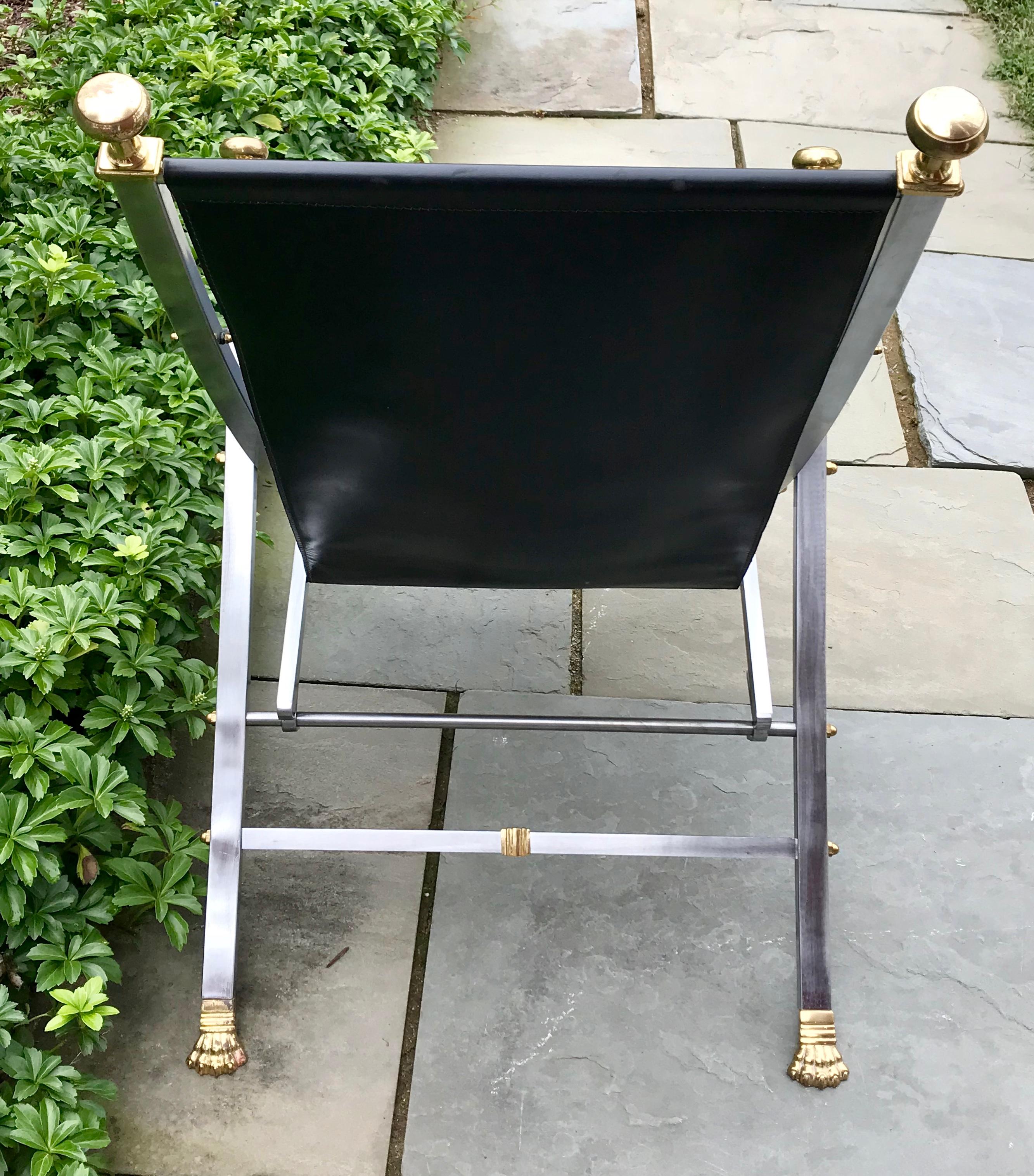 Beautiful Maison Jansen leather campaign chair, solid steel with brass finials, 1960s.