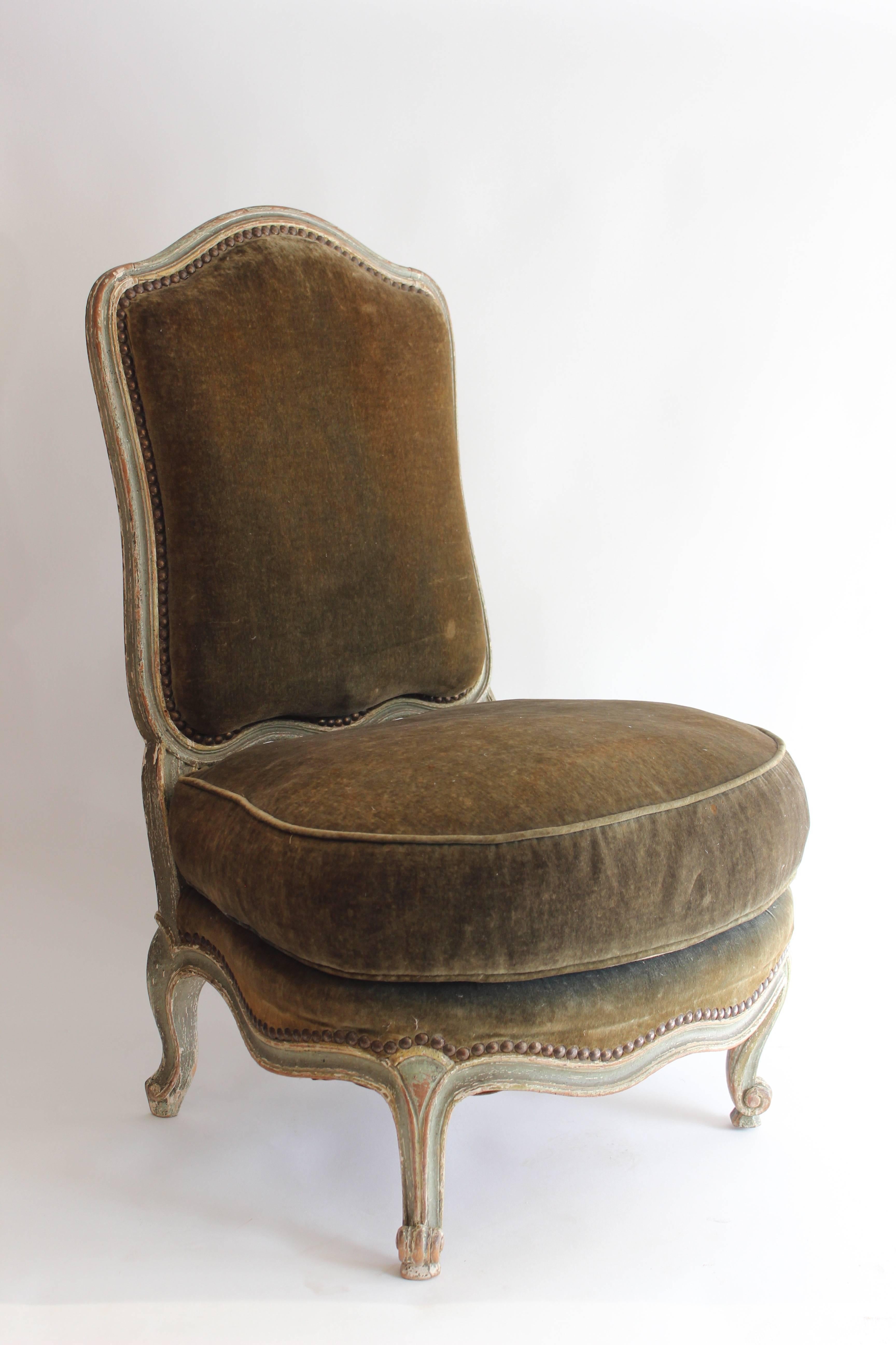 Maison Jansen Louis XV style boudoir chair having arched back over loose cushion seat and with cabriole legs, circa 1920.