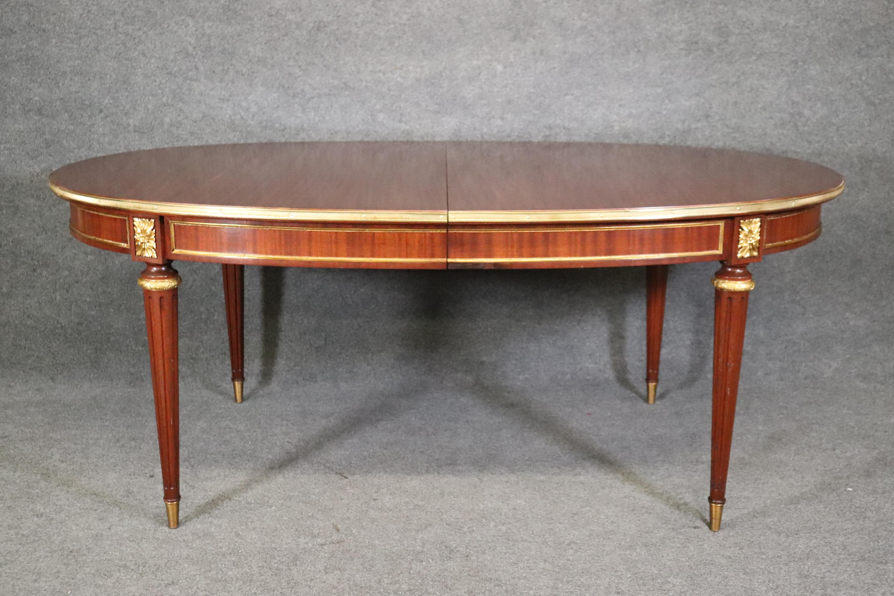 Polished Maison Jansen Louis XVI Style Mahogany Dining Table With Two Leaves  For Sale