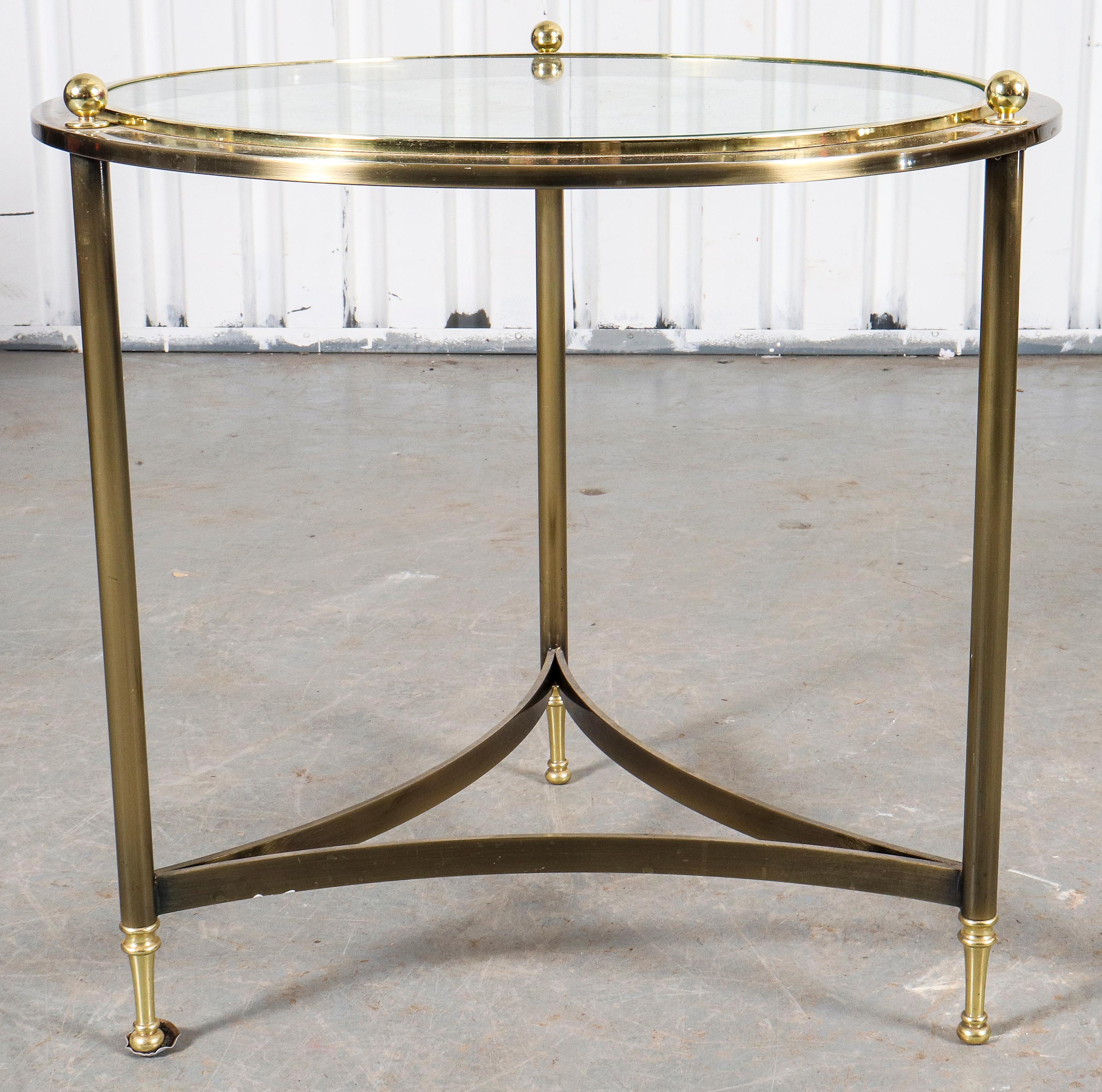 Maison Jansen manner round side table with metal tripod frame and glass top. Measures: 24
