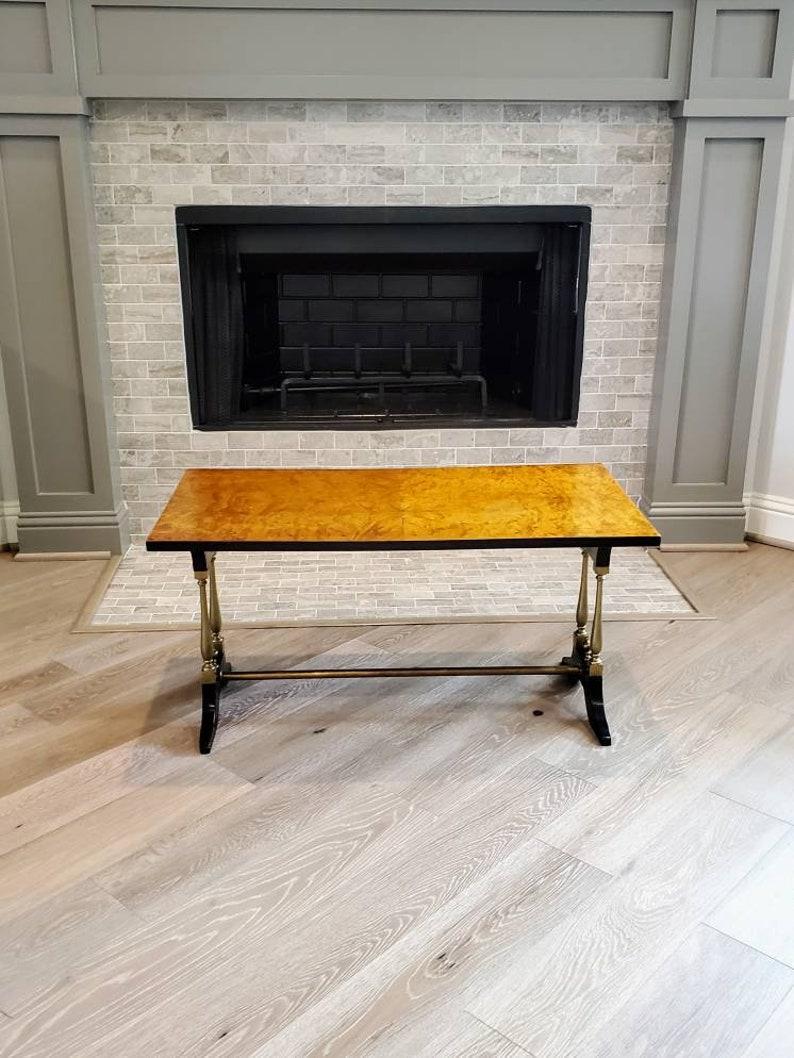A superb French midcentury cocktail table attributed to Maison Jansen. Fine craftsmanship and quality, exceptionally executed, rectangular shape, having gorgeous olive burl wood top with beautiful, rich coloring, luxurious depth, and elegant warm