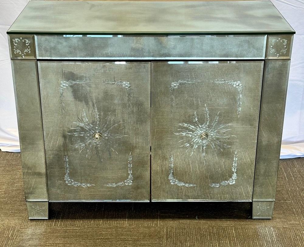 Maison Jansen Mirrored Cabinet, Commode, Verre Eglomise, Mid Century Modern
 
A magnificent Hollywood Regency example of work from the highly sought after Maison Jansen, this mid-20th century two-door cabinet is built completely with evocatively