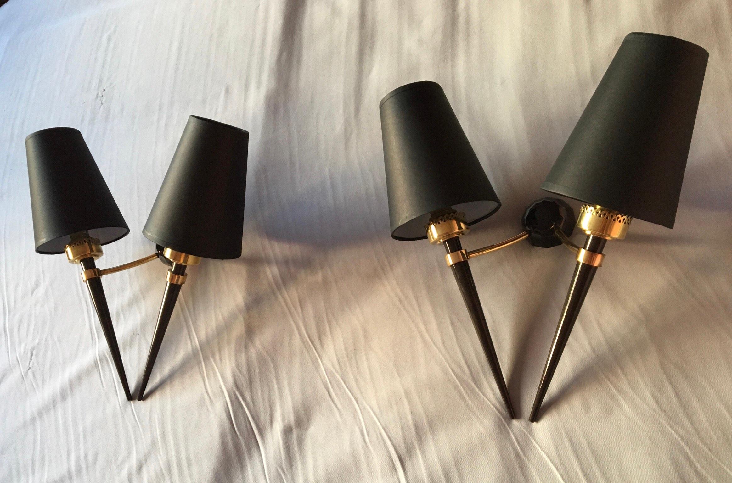 Beautiful pair of French Neoclassical Maison Jansen double arm sconces in bronze, brass with dark patina and lampshades . Electric parts fit the US standard ( baïonnette bulb holder maxi 100 watts ).
The black hardboard lampshades are new and