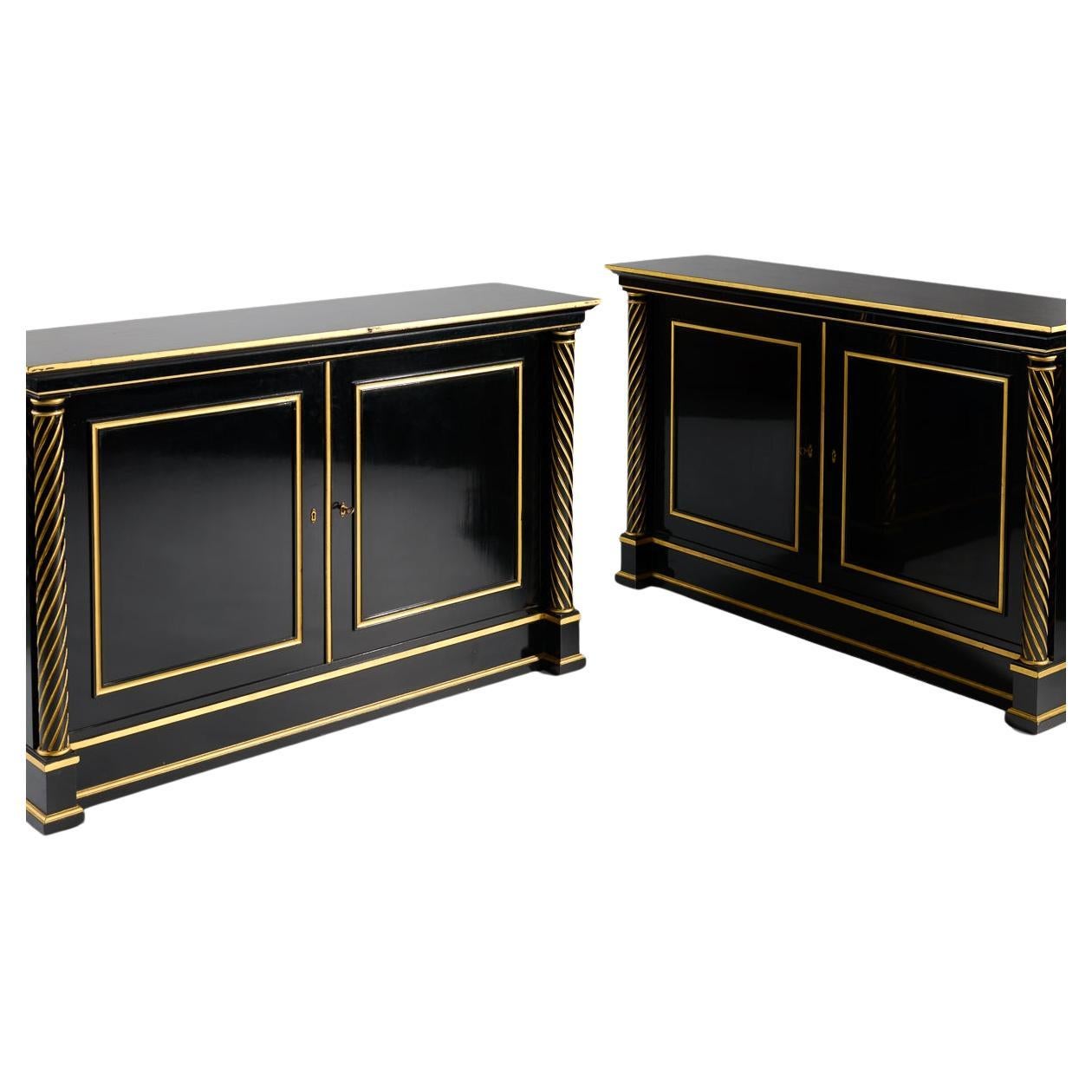 Twin columns of twisted gilt wood form the vertical borders of this gracefully symmetrical, black lacquered, double door cabinet.

Provenance:
In 1965 Maison Jansen decorated a Paris apartment in the 8th arrondissement, and when the clients retired
