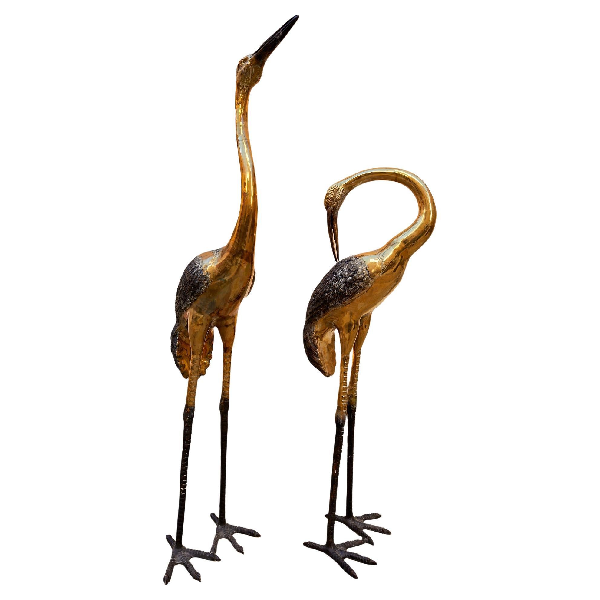 Maison Jansen, Pair of bronze herons with a double silver and gold patina.