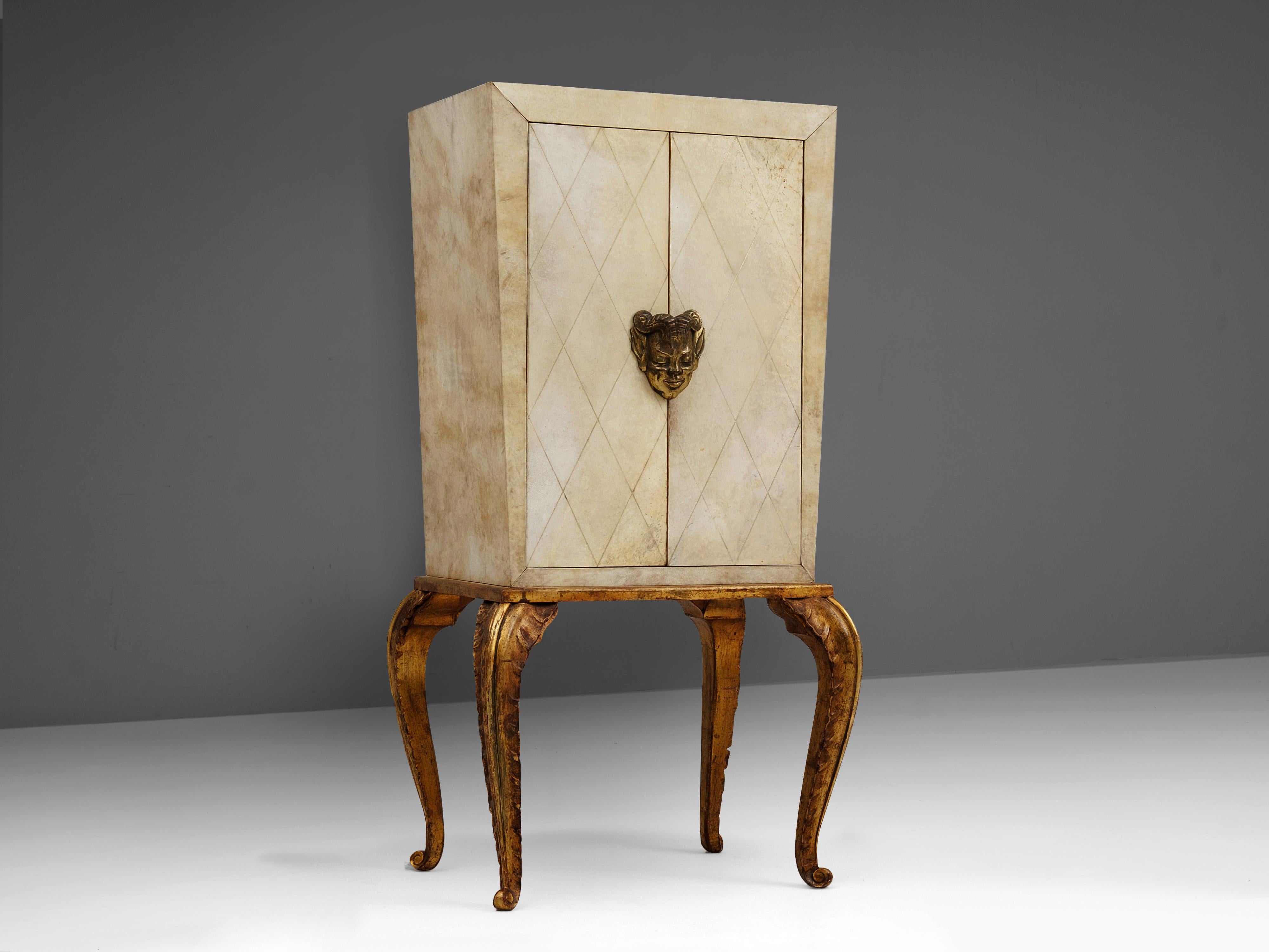 Maison Jansen, cabinet, wood, parchment, France, 1940s

A rare and beautiful Art Deco cabinet designed by Parisian decorator Maison Jansen in the 1940s. On beautiful sculpted, slightly golden legs rests the cabinet. It is highlighted with parchment