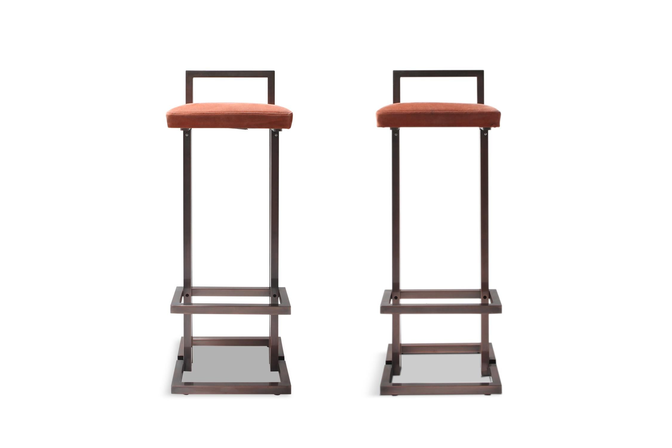 Hollywood Regency stools in patinated brass

coral velvet upholstered seats



 