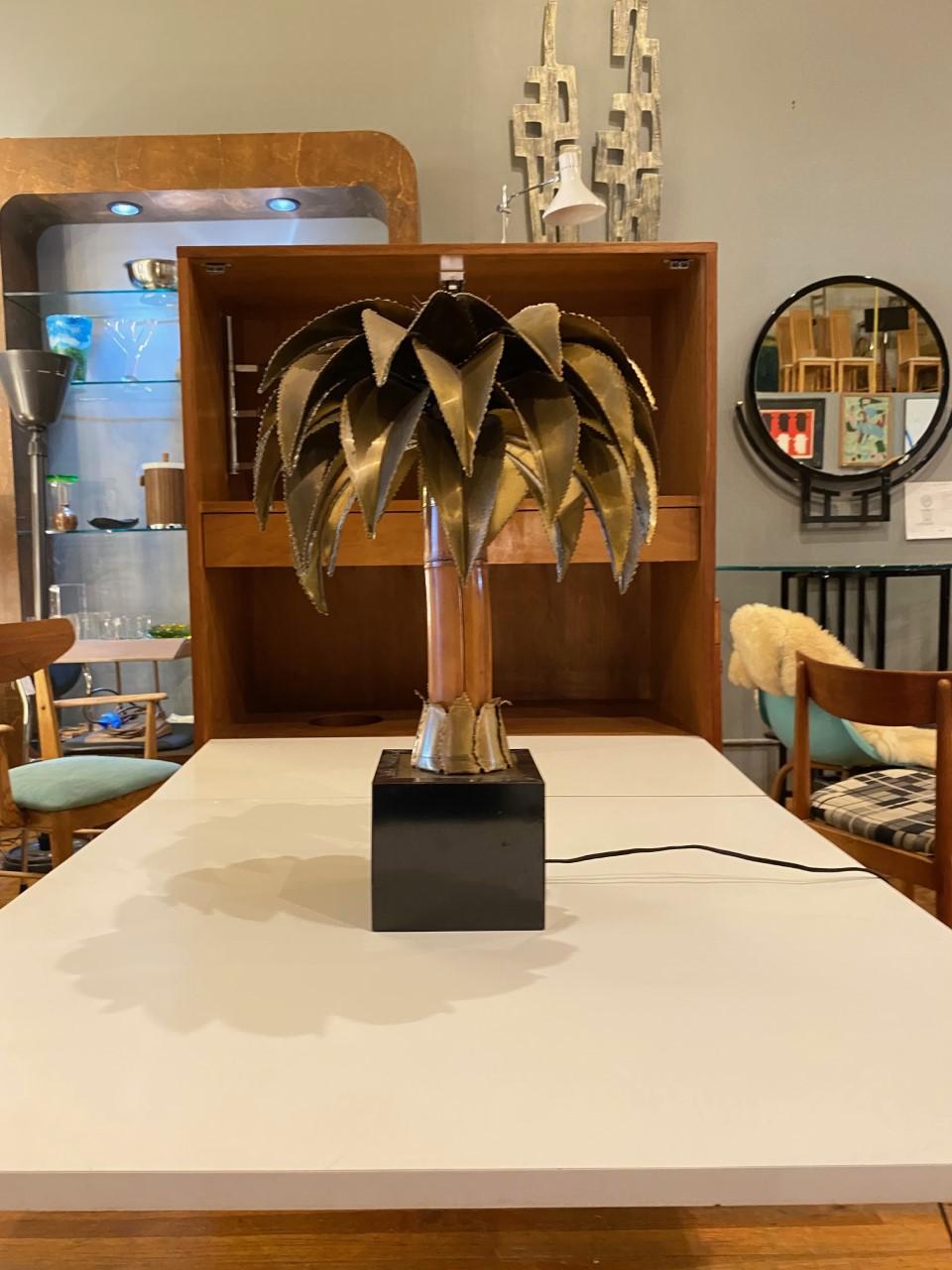 Sculptural and unique palm tree sculpture table lamp by Christian Techoueyres for Maison Jensen. This lamp creates a beautiful impact in your décor and creates atmospheric lighting and visual impact in your interiors. The trunk is palm wood with