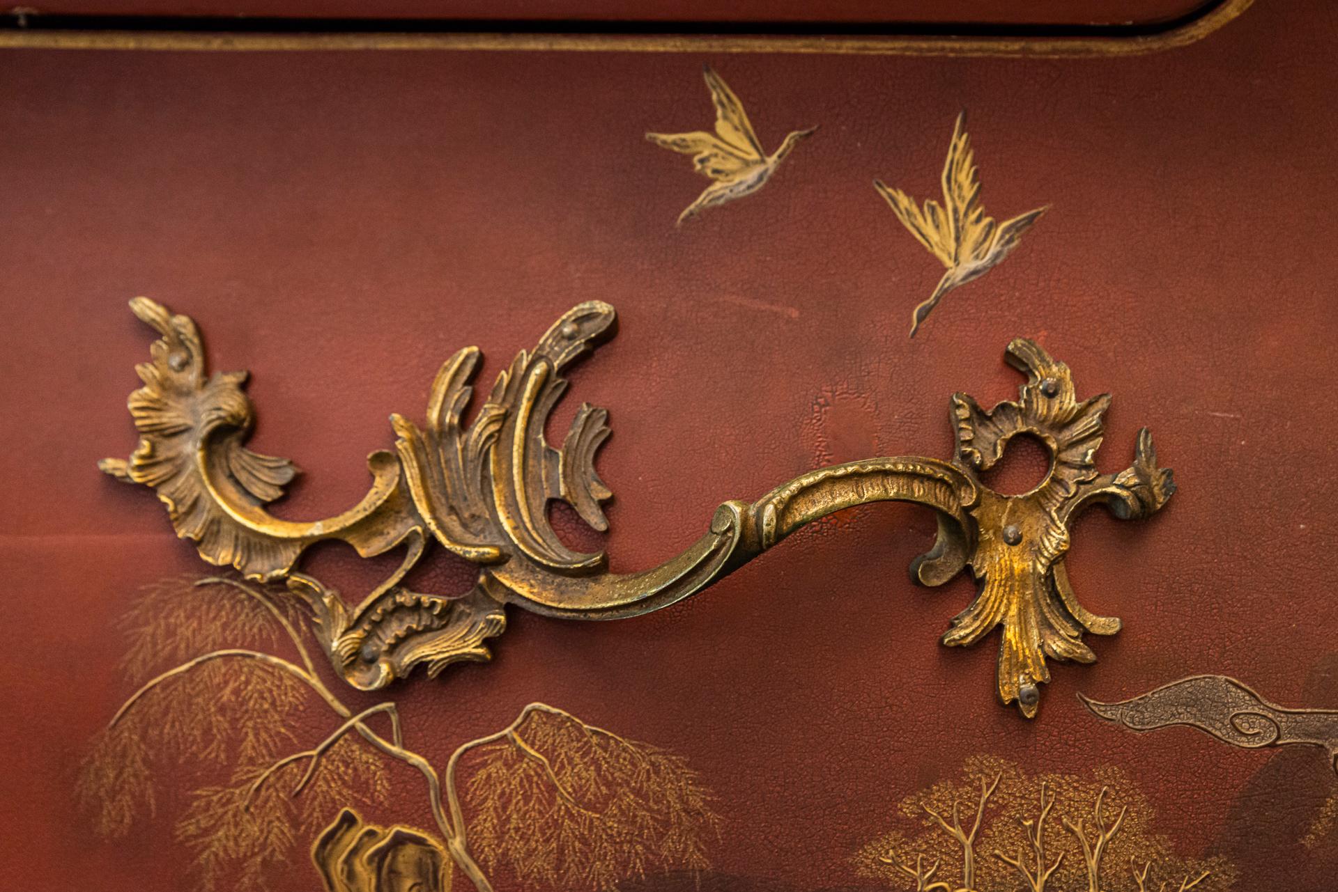 Maison Jansen, Sideboard in the style of Louis XV
Red lacquered decorated with chinoiseries,
Curved base with two drawers, decorated with fishing scenes,
Chiselled and gilt handles, feet, angles and keyholes,
Marble tabletop,
France, circa