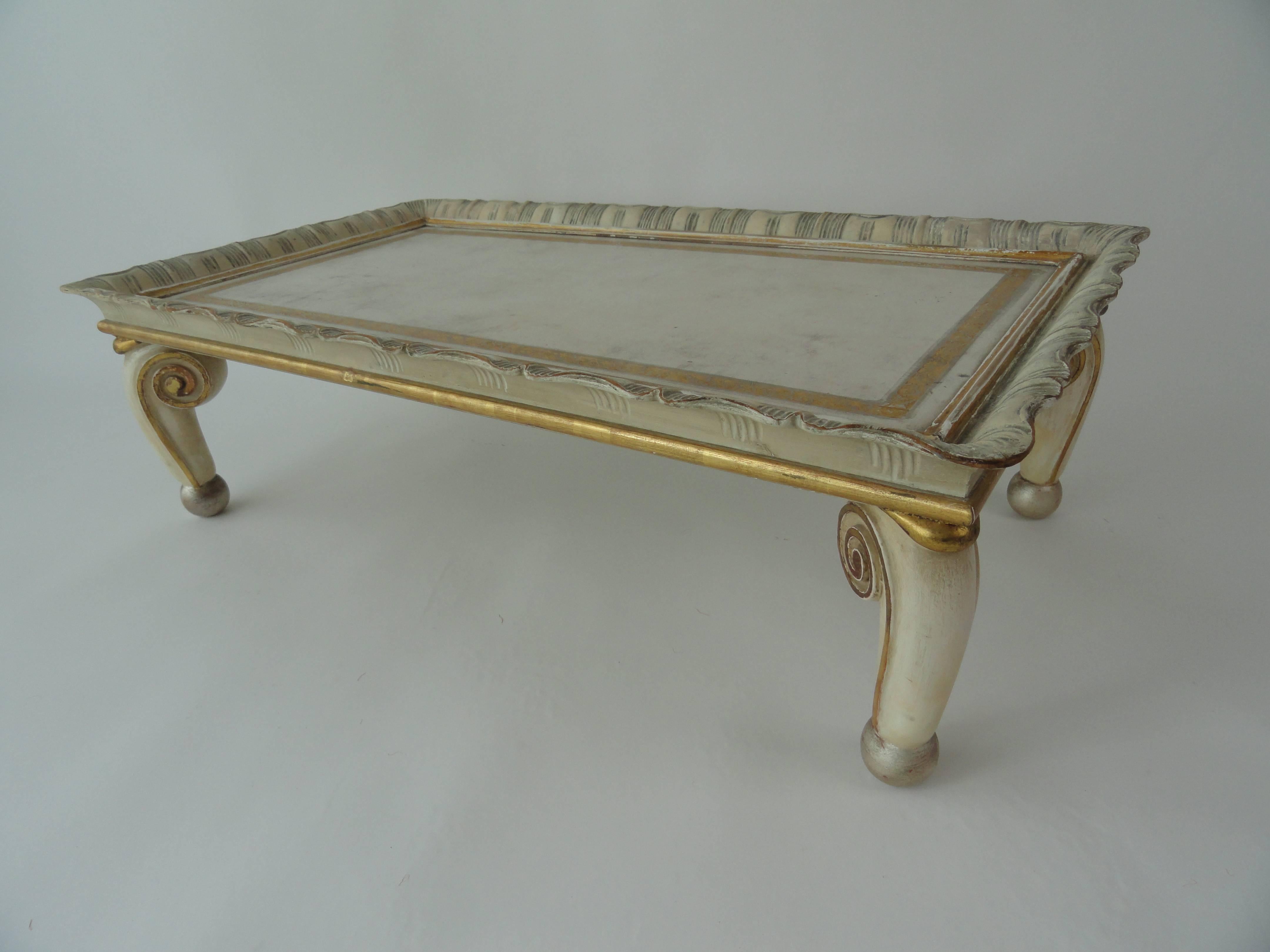Signed and numbered Maison Jansen tray, circa 1952.
Wood carved tray table with original paint, gilt and tooled leather top.  Wear consistent with age.
Very rare and unusual.
Measures 35