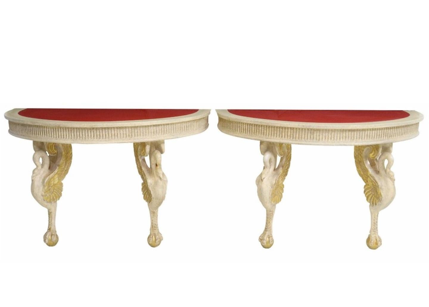 A fabulous pair of French Empire style demilune paint-decorated wood console tables by iconic Parisian luxury design house Maison Jansen (Paris, France; 1880-1989)

Finished in Mid-20th Century glitz and glam Hollywood Regency taste, the rare,