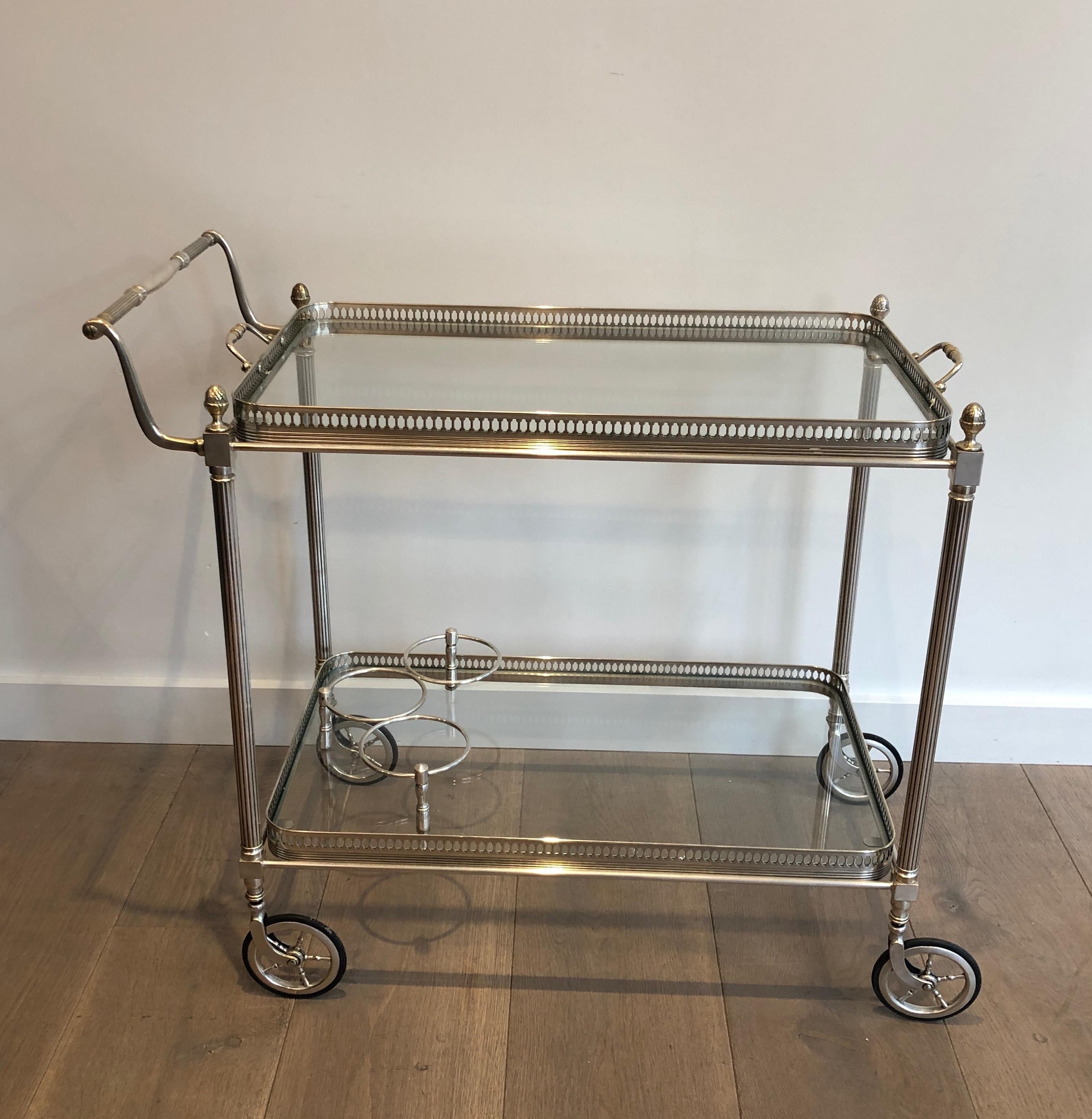 This very nice neoclassical drinks trolley is made of silvered on brass with removable tray. This is a work by famous French designer Maison Jansen, circa 1940.