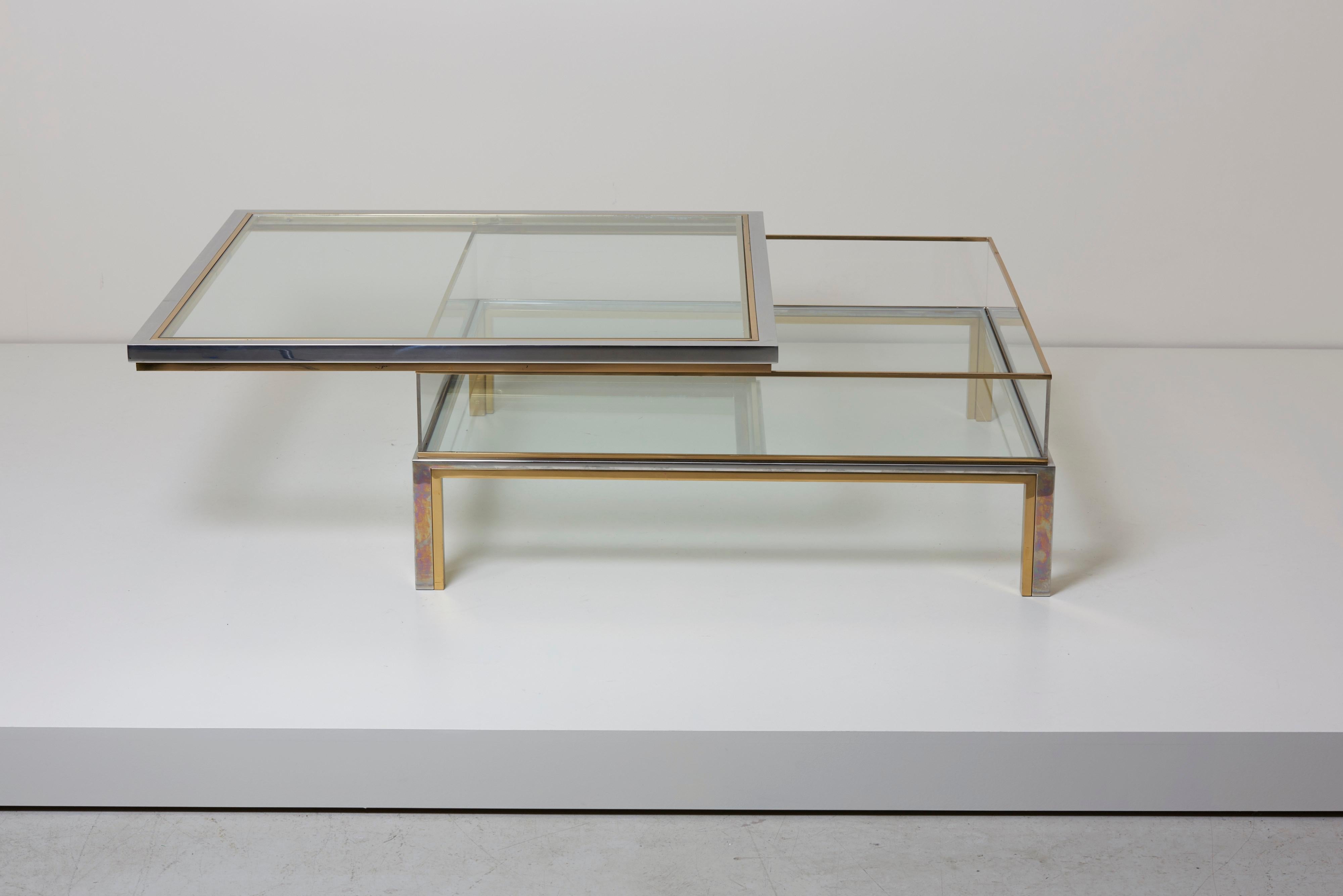 Large square glass table with sliding top by Maison Jansen. Frame has an total original gold-plated and chrome metal finish.

