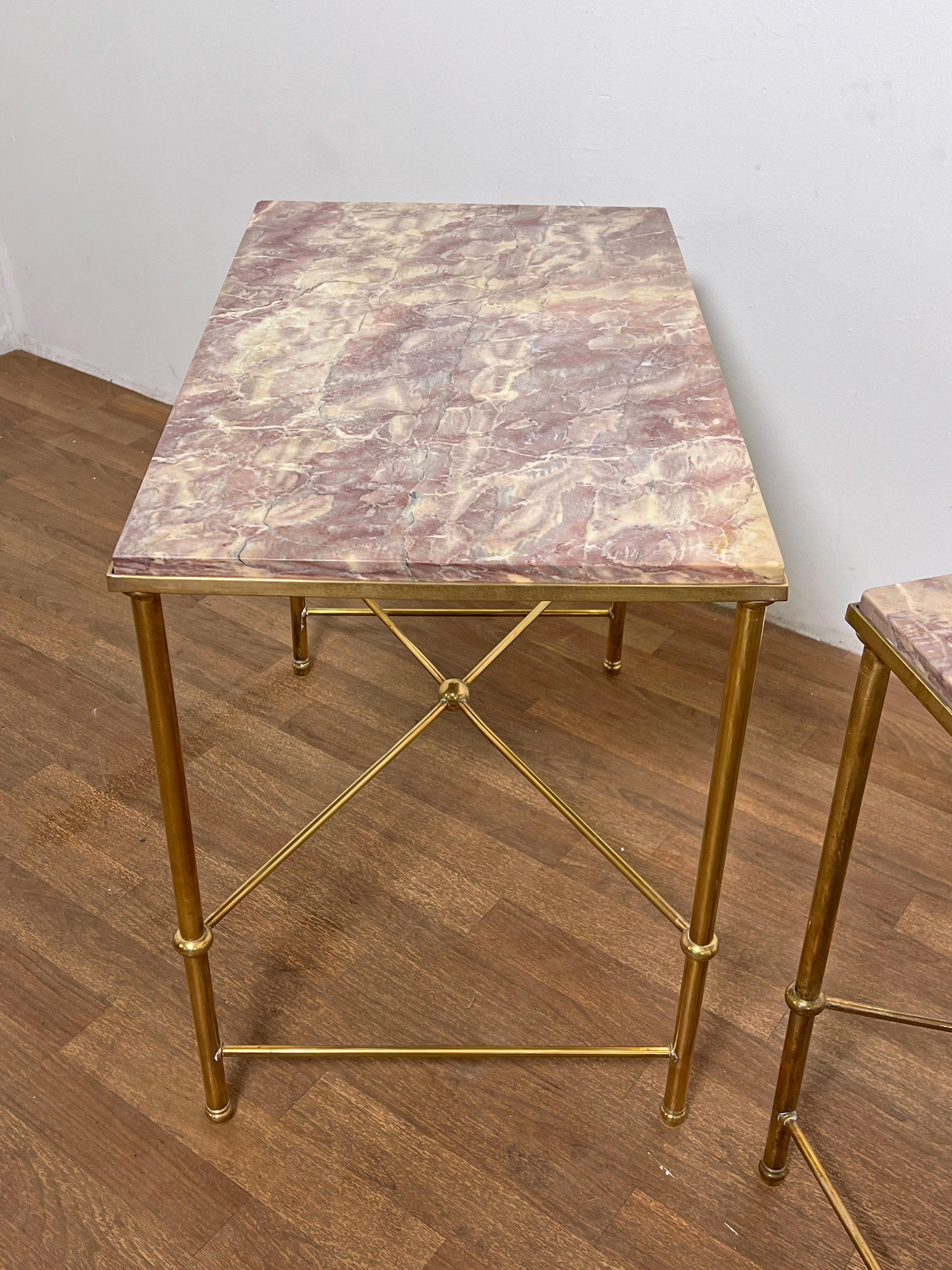 A 1950s solid brass coffee table attributed to Maison Jansen with rare lavender marble top. 
A complementing coffee table with matching marble from the same estate is available in another listing.