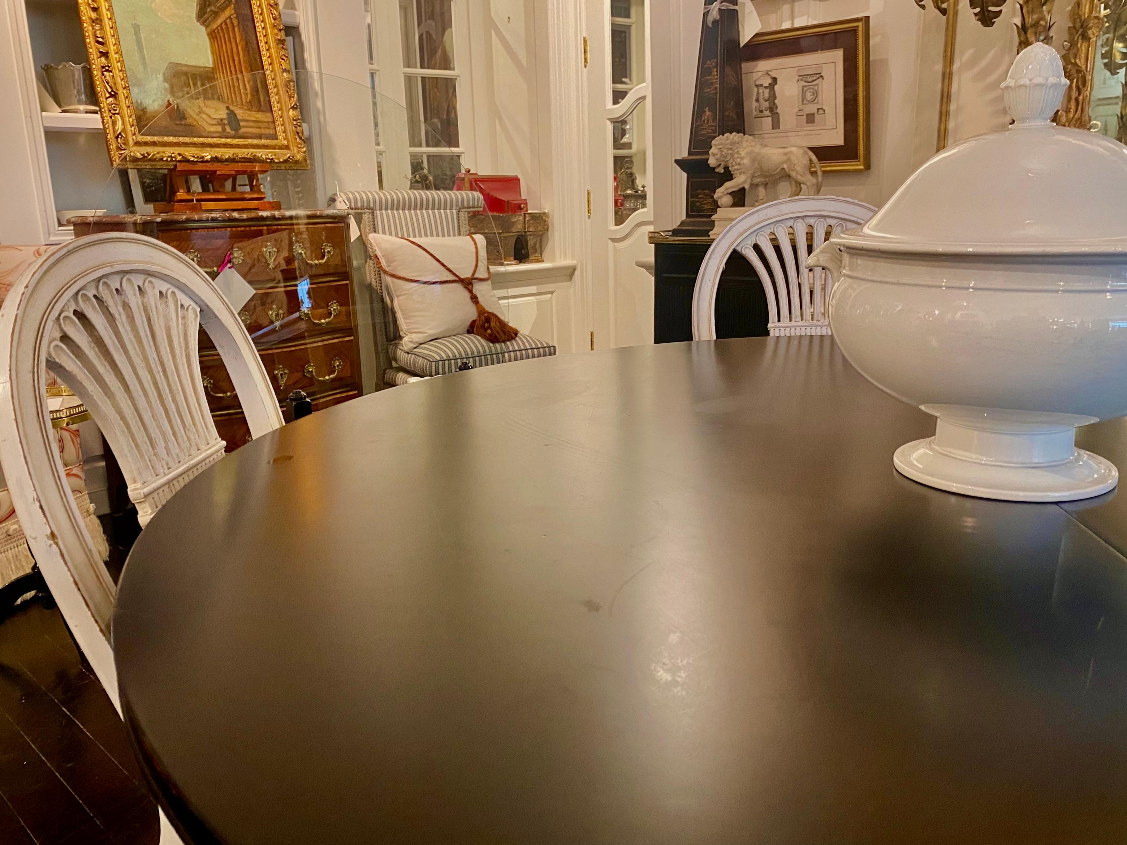 Maison Jansen Stamped Black Table, French, Louis XVI Style, Mid-Century Modern

Versatile Dining Table, bearing the clear Maison Jansen marking, and all the hallmarks of a Maison Jansen piece - a chic, jewel-like, very decorative rendition of a