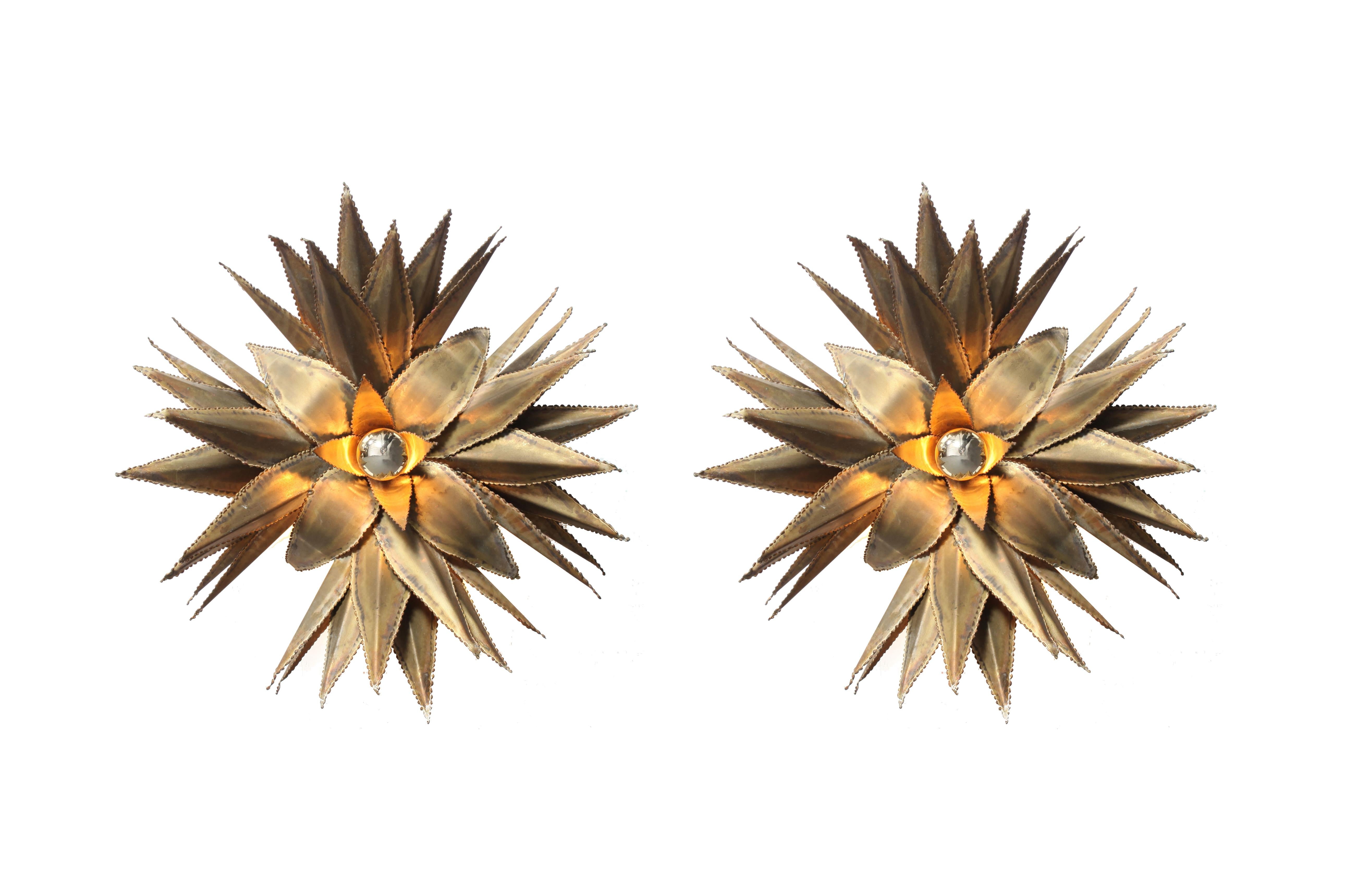 Hollywood Regency handmade fixtures by Maison Jansen.
Brass star shaped palm tree wall light, custom made for a Belgian hotel in the 1970s.
 
