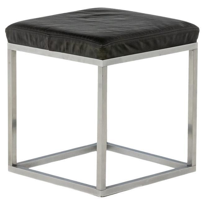 Maison Jansen. Stool in brushed aluminum and black leather. 1970s.