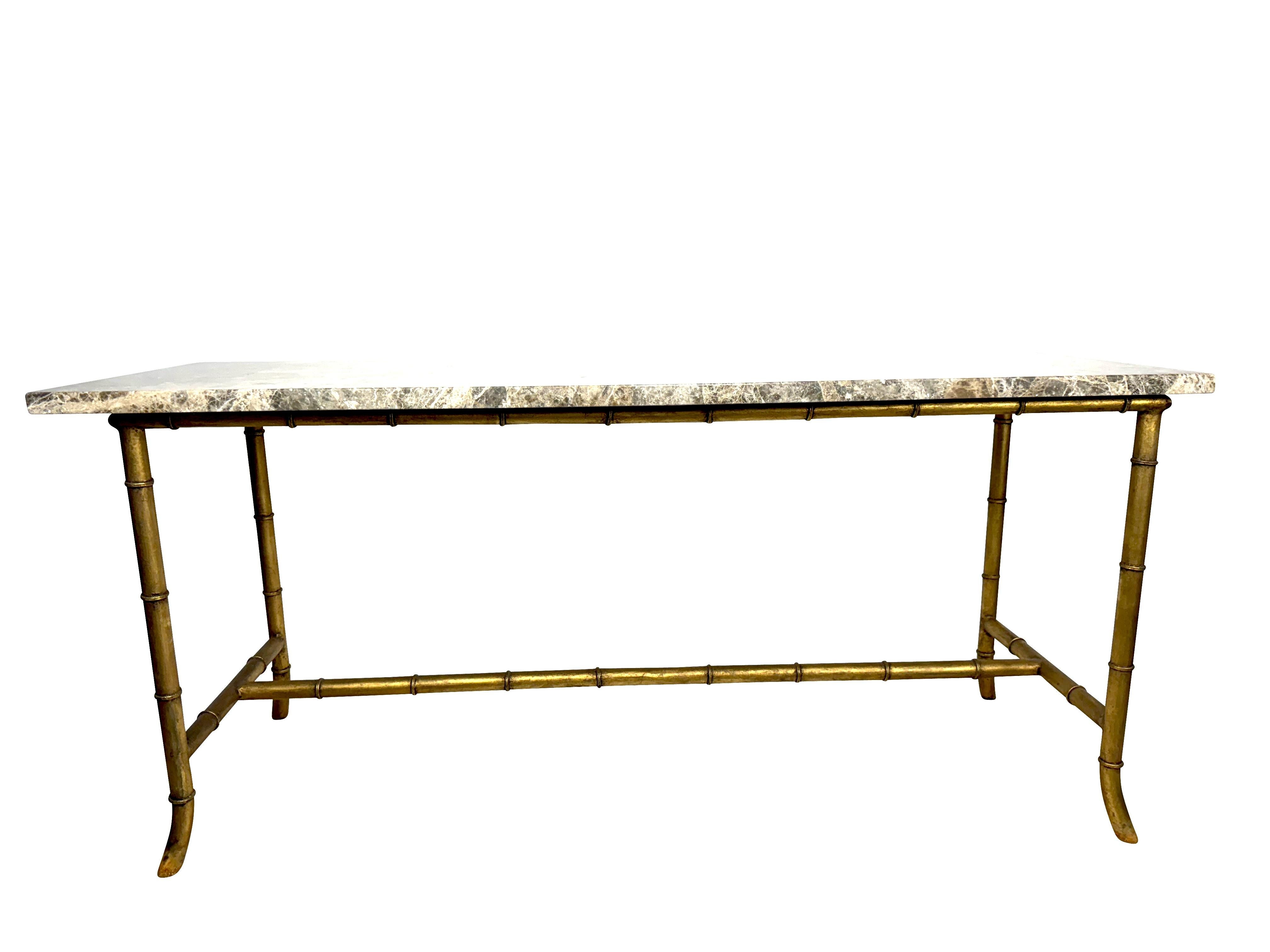 1940's Maison Jansen style brass Bamboo console table with exceptionally fine casting and patina throughout with professionally polished heavy brown marble top,  The table measures 64.5 L X 22.5 W X 30 H .  It would be lovely in a foyer, living room