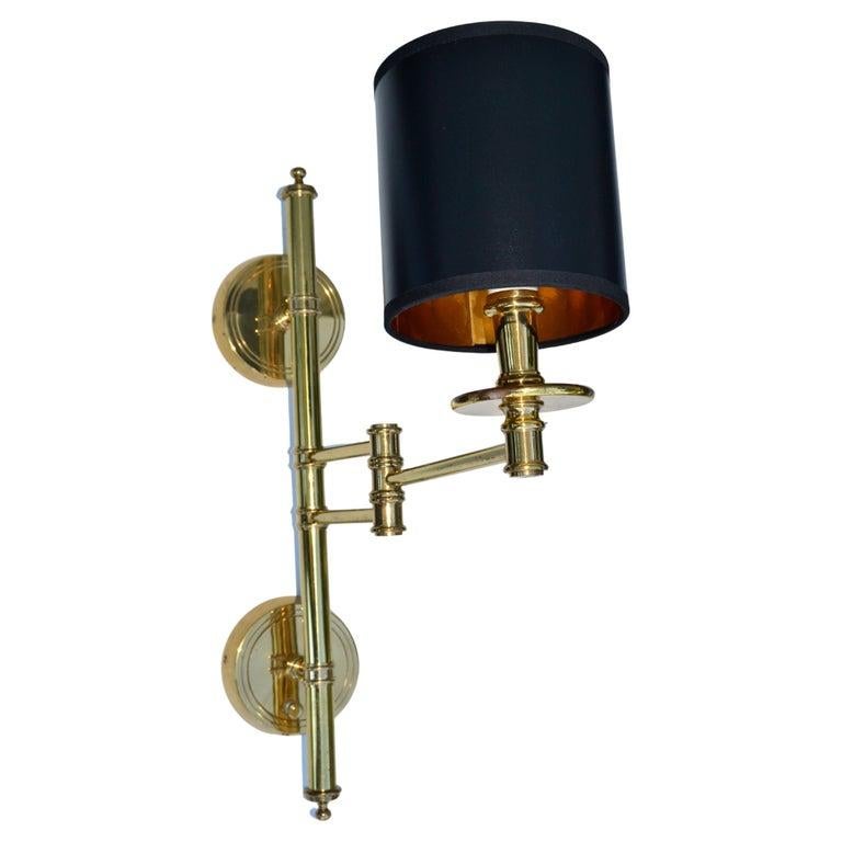 Very elegant brass retractable Maison Jansen Sconce France with drum shade in black & gold.
Wired for the US, UL Listing and the sconce takes one light bulb with max. 60 watts. Dimmer Switch.
Measurement: Max projection to the wall 19 inches